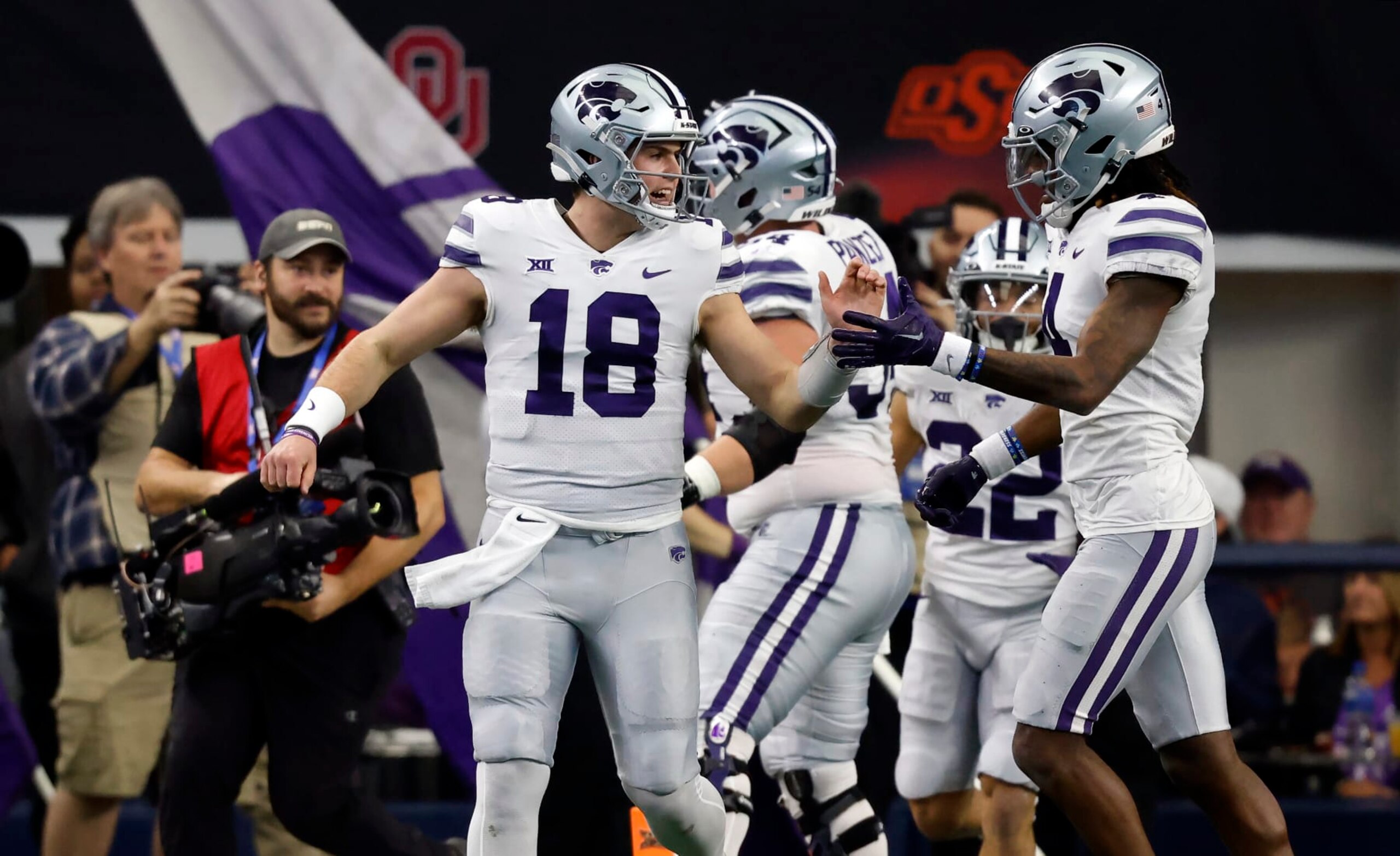 ARLINGTON, TX - DECEMBER 3: Will Howard #18 of the Kansas State Wildcats celebrates with teammates after throwing a touchdown pass against the TCU Horned Frogs in the first half of the Big 12 Football Championship at AT&T Stadium on December 3, 2022 in Arlington, Texas.  (Photo by Ron Jenkins/Getty Images)