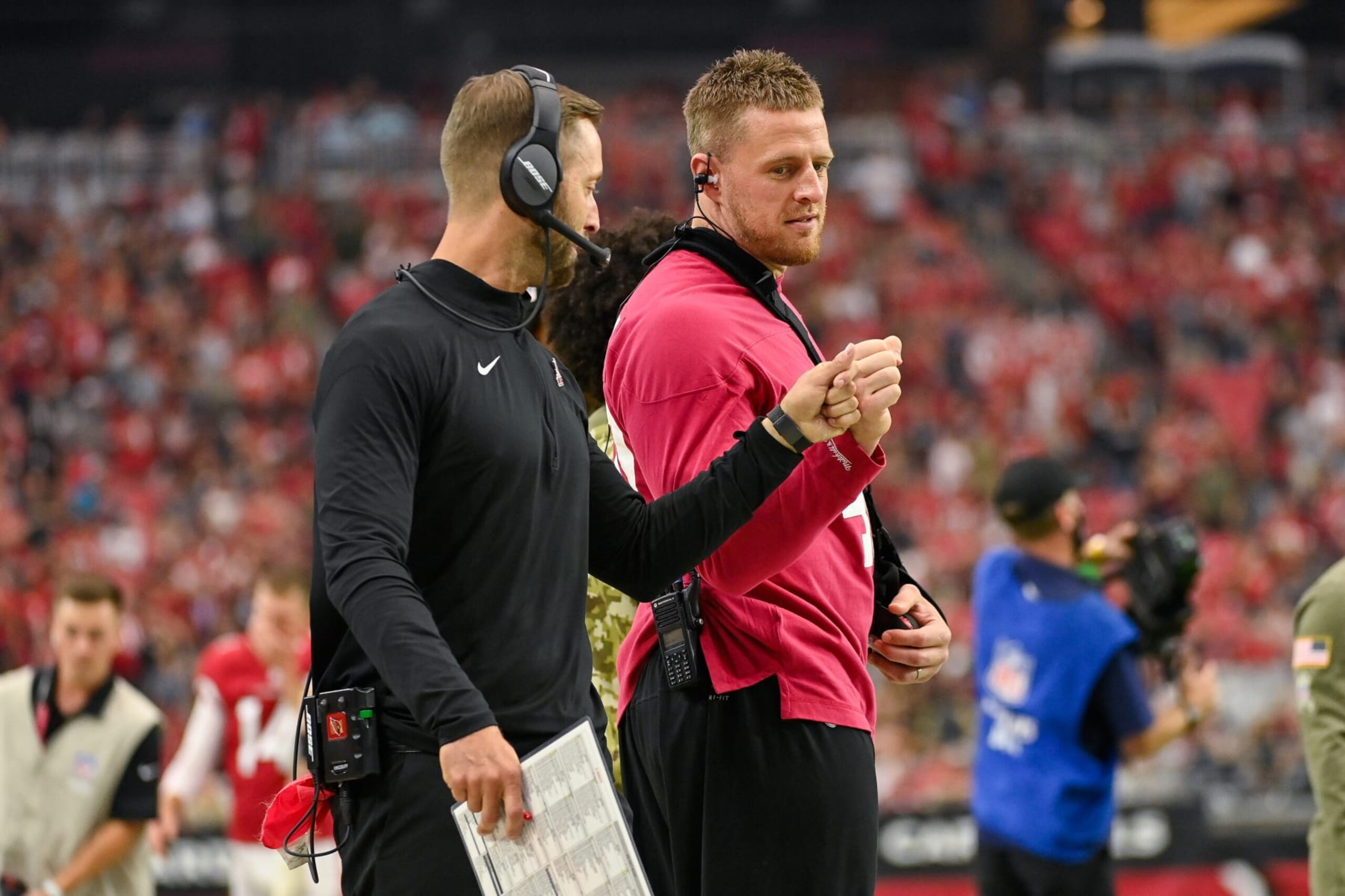 GLENDALE, ARIZONA - NOVEMBER 14: Head coach Kliff Kingsbury and J.J. Watt #99 of the Arizona Cardinals fist bump prior to the game against the Carolina Panthers at State Farm Stadium on November 14, 2021 in Glendale, Arizona. The Panthers defeated the Cardinals 34-10. (Photo by Kelsey Grant/Getty Images)