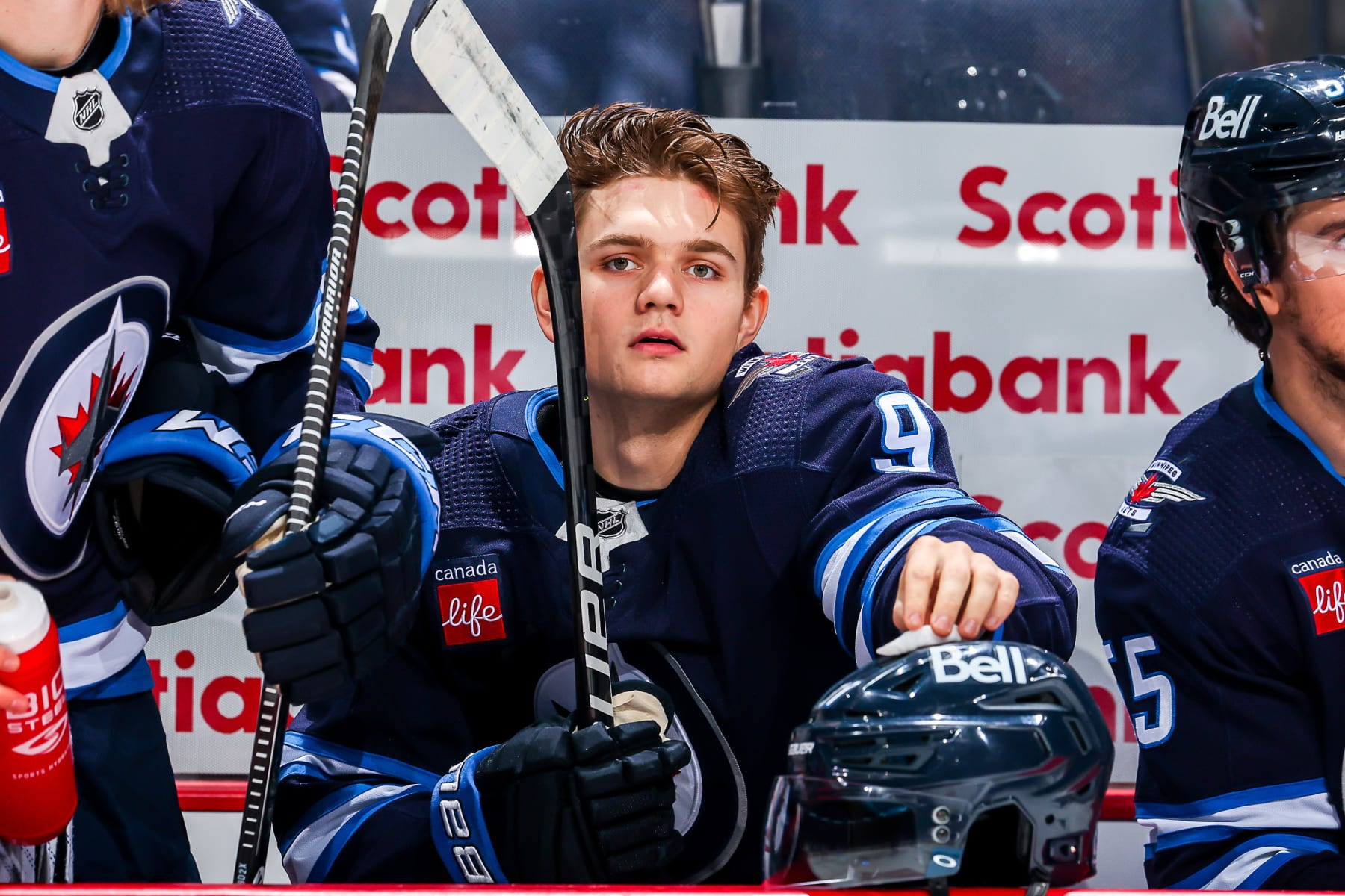 WINNIPEG, CANADA - DECEMBER 20: Cole Perfetti #91 of the Winnipeg Jets looks on from the bench prior to puck drop against the Ottawa Senators at the Canada Life Centre on December 20, 2022 in Winnipeg, Manitoba, Canada. (Photo by Jonathan Kozub/NHLI via Getty Images)