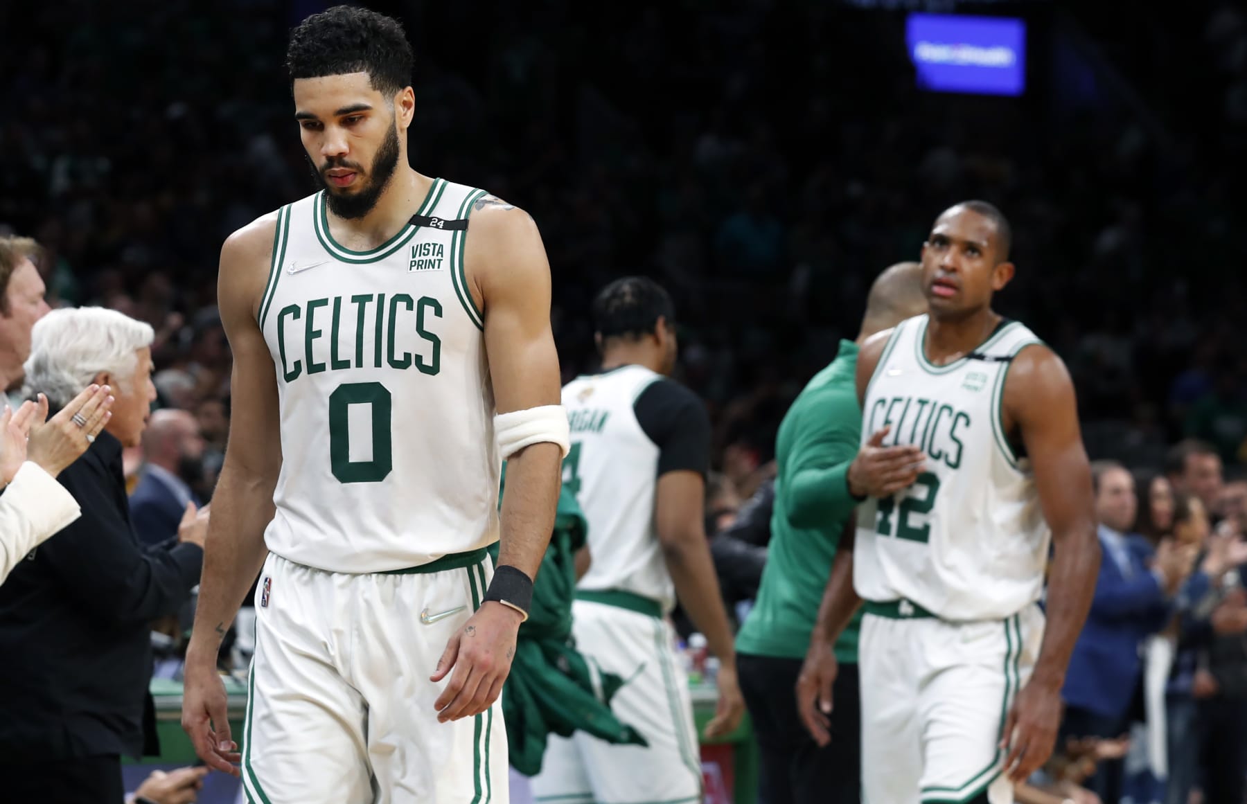 Boston - June 16: The Celtics Jayson Tatum (0) and Al Horford  (42, getting a pat from head coach Ime Udoka) as they head for the bench as they are removed from the game with the outcome not in doubt. The Boston Celtics hosted the Golden State Warriors for Game Six of the NBA Finals at the TD Garden in Boston on June 17, 2022. (Photo by Jim Davis/The Boston Globe via Getty Images)