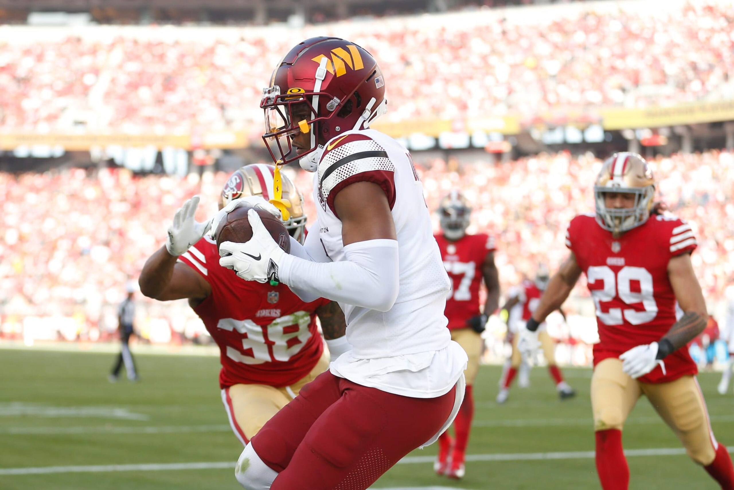 SANTA CLARA, CALIFORNIA - DECEMBER 24: Jahan Dotson #1 of the Washington Commanders makes a catch in the end zone for a touchdown in the second quarter against the San Francisco 49ers at Levi's Stadium on December 24, 2022 in Santa Clara, California. (Photo by Lachlan Cunningham/Getty Images)