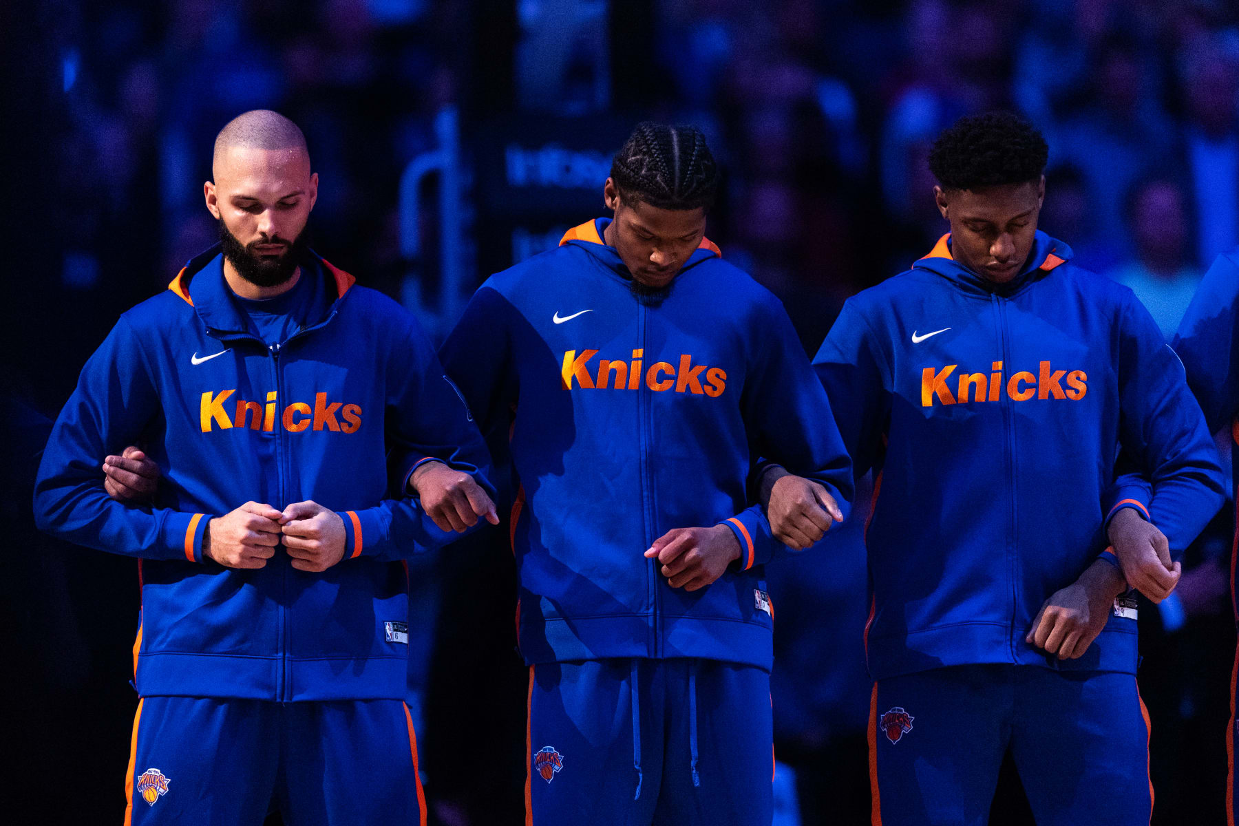 NEW YORK, NEW YORK - OCTOBER 24: Evan Fournier #13, Cam Reddish #0 and RJ Barrett #9 of the New York Knicks during the national anthem before the start of the game against the Orlando Magic at Madison Square Garden on October 24, 2022 in New York City. NOTE TO USER: User expressly acknowledges and agrees that,  by downloading and or using this photograph,  User is consenting to the terms and conditions of the Getty Images License Agreement. (Photo by Dustin Satloff/Getty Images)