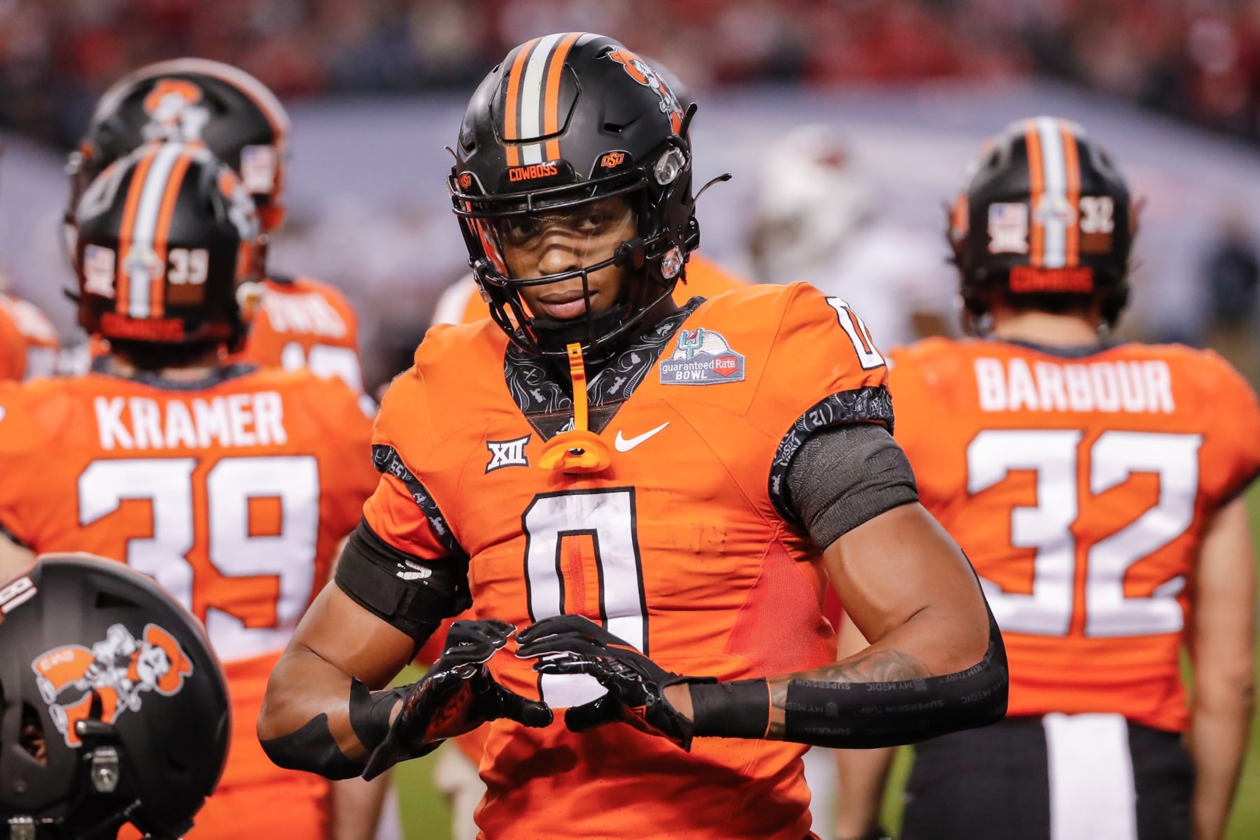 PHOENIX, AZ - DECEMBER 27:  Oklahoma State Cowboys running back Ollie Gordon (0) gestures during the college football Guaranteed Rate Bowl game between the Wisconsin Badgers and the Oklahoma State Cowboys on December 27, 2022 at Chase Field in Phoenix, Arizona. (Photo by Kevin Abele/Icon Sportswire via Getty Images)