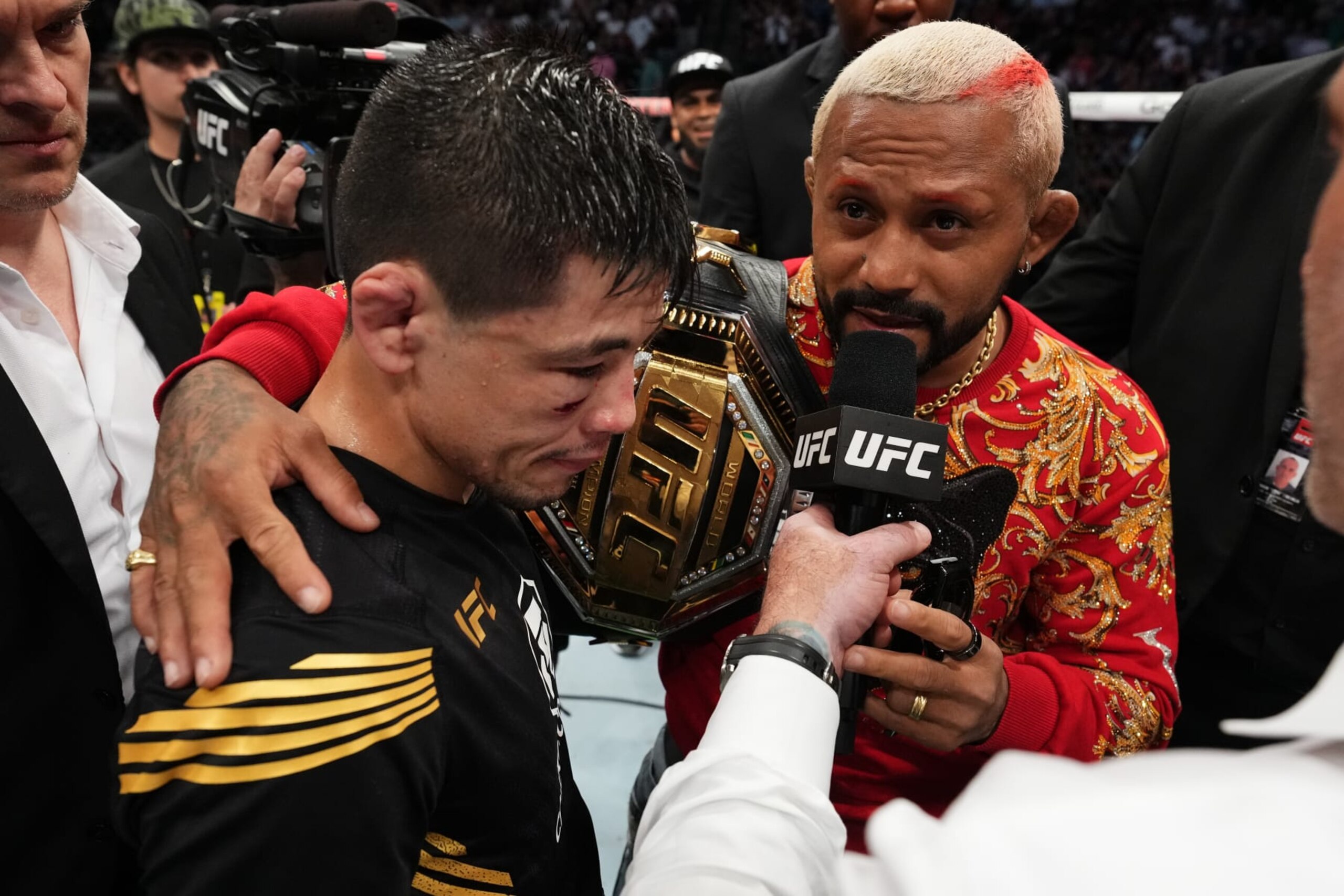 DALLAS, TEXAS - JULY 30: (L-R) Brandon Moreno of Mexico and Deiveson Figueiredo of Brazil interact after Moreno defeated Kai Kara-France of New Zealand in the interim UFC flyweight championship fight during the UFC 277 event at American Airlines Center on July 30, 2022 in Dallas, Texas. (Photo by Josh Hedges/Zuffa LLC)