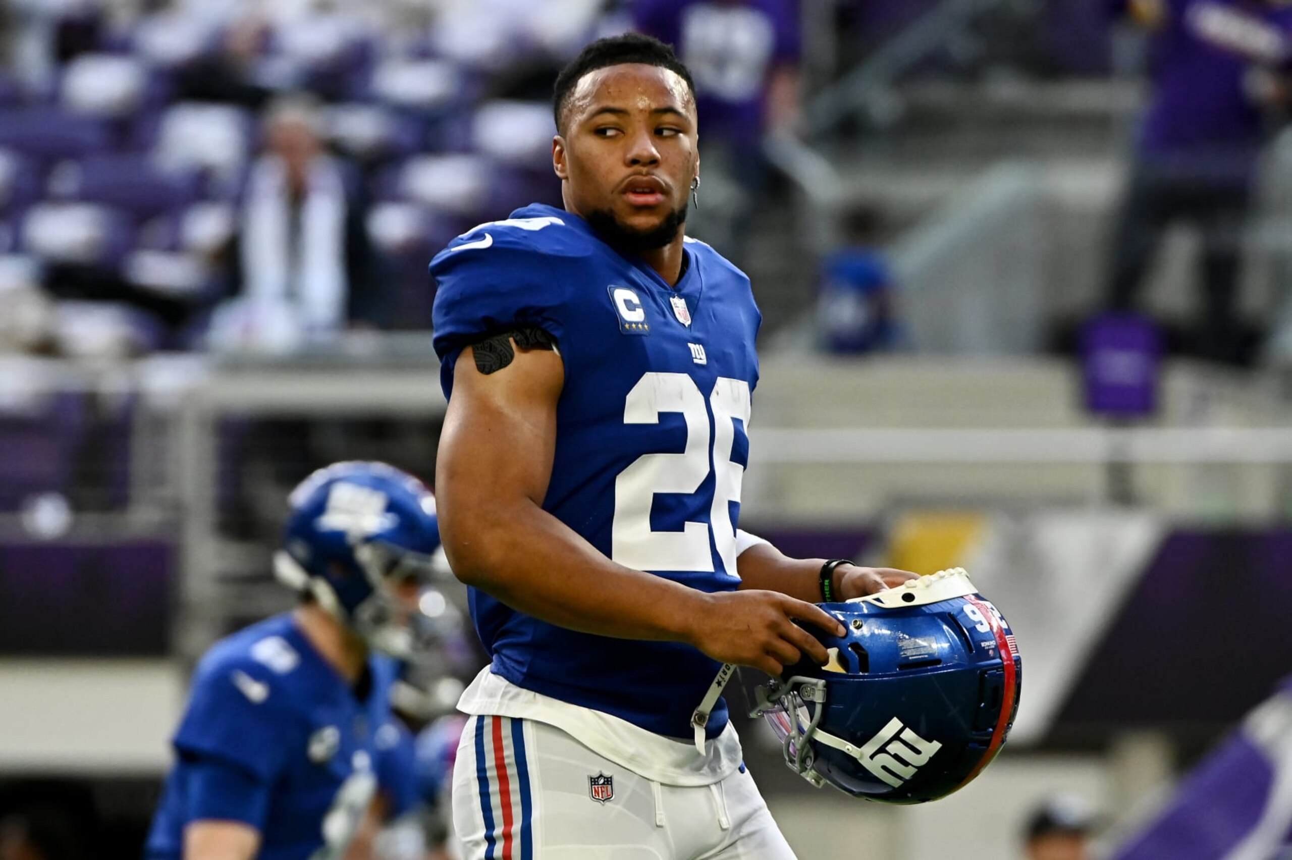 MINNEAPOLIS, MINNESOTA - DECEMBER 24: Saquon Barkley #26 of the New York Giants looks onward during pregame against the Minnesota Vikings at U.S. Bank Stadium on December 24, 2022 in Minneapolis, Minnesota. (Photo by Stephen Maturen/Getty Images)