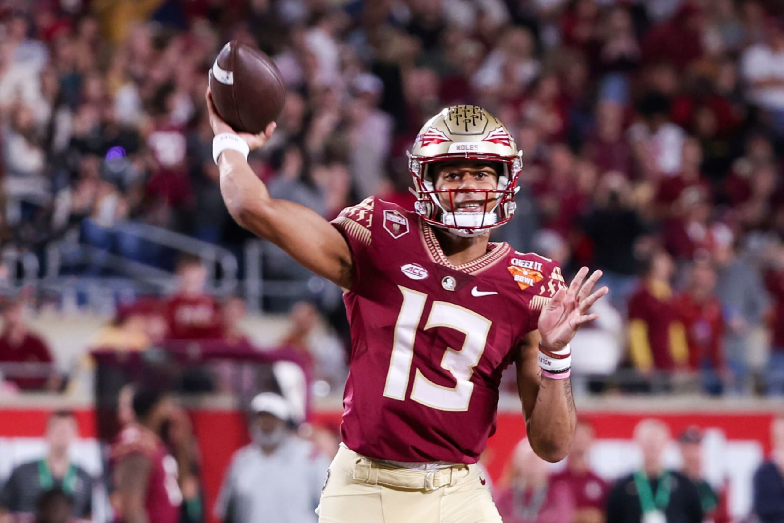 ORLANDO, FL - DECEMBER 29: Florida State Seminoles quarterback Jordan Travis (13) passes the ball during the Cheez-It Bowl between Oklahoma and Florida State on December 29, 2022 at Camping World Stadium, in Orlando FL. (Photo by Joe Petro/Icon Sportswire via Getty Images)