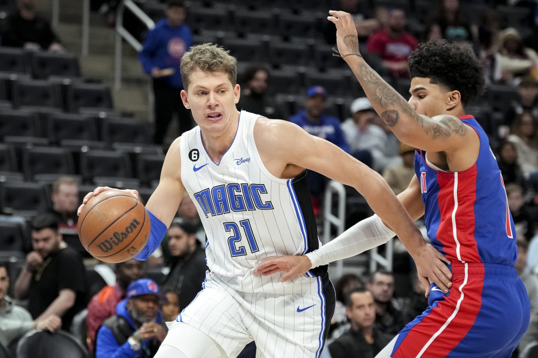 DETROIT, MICHIGAN - DECEMBER 28: Moritz Wagner #21 of the Orlando Magic handles the ball against Killian Hayes #7 of the Detroit Pistons during the first quarter at Little Caesars Arena on December 28, 2022 in Detroit, Michigan. NOTE TO USER: User expressly acknowledges and agrees that, by downloading and or using this photograph, User is consenting to the terms and conditions of the Getty Images License Agreement. (Photo by Nic Antaya/Getty Images)