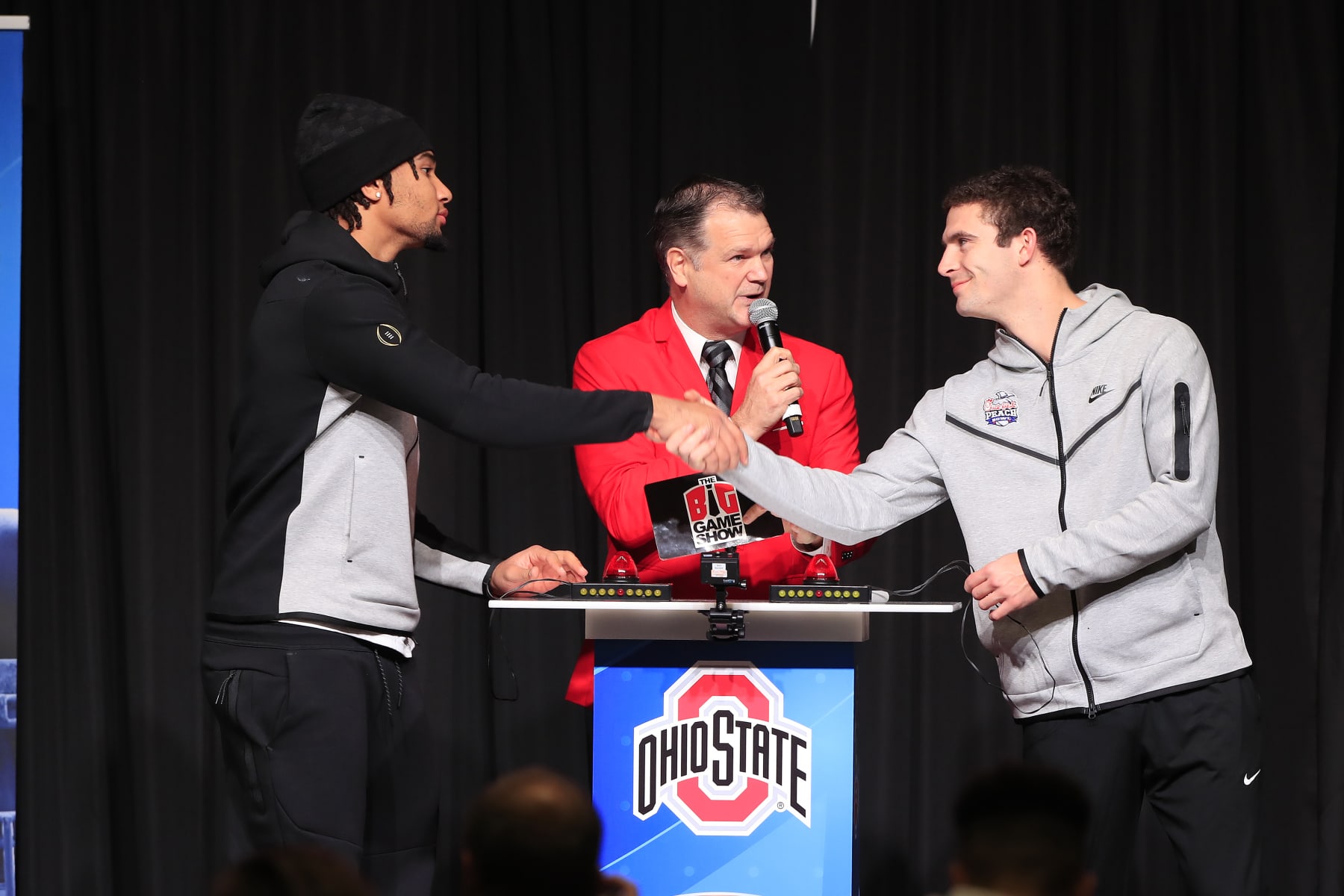 ATLANTA, GA - DECEMBER 26: Ohio State Buckeyes starting quarterback C.J. Stroud (l) and Georgia Bulldogs starting quarterback Stetson Bennett (r) shake hands  before the Battle for Bowl Week dinner between the University of Georgia Bulldogs and The Ohio State Buckeyes at the College Football Hall of Fame on December 26, 2022 in Atlanta, GA.  (Photo by David J. Griffin/Icon Sportswire via Getty Images)