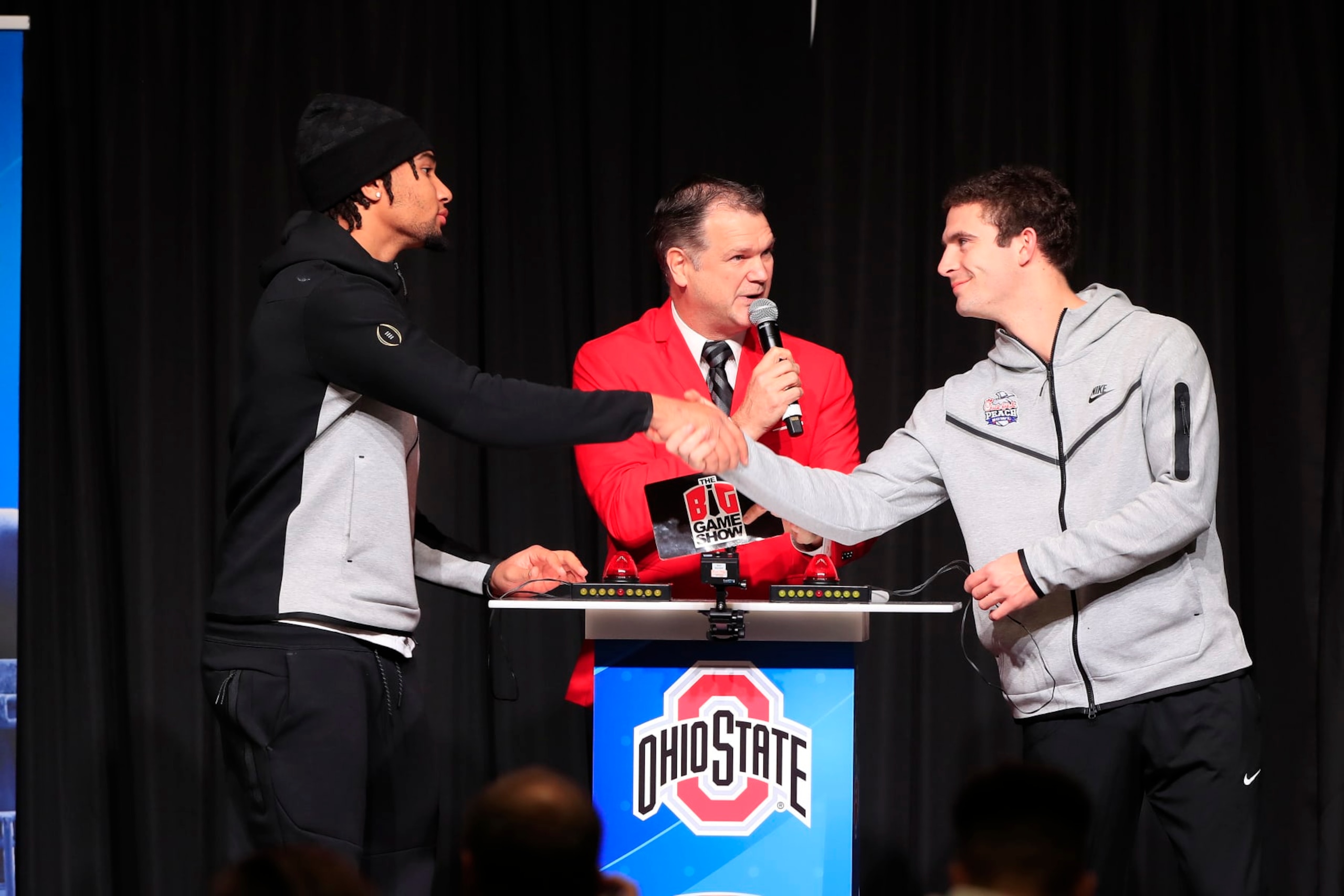ATLANTA, GA - DECEMBER 26: Ohio State Buckeyes starting quarterback C.J. Stroud (l) and Georgia Bulldogs starting quarterback Stetson Bennett (r) shake hands  before the Battle for Bowl Week dinner between the University of Georgia Bulldogs and The Ohio State Buckeyes at the College Football Hall of Fame on December 26, 2022 in Atlanta, GA.  (Photo by David J. Griffin/Icon Sportswire via Getty Images)