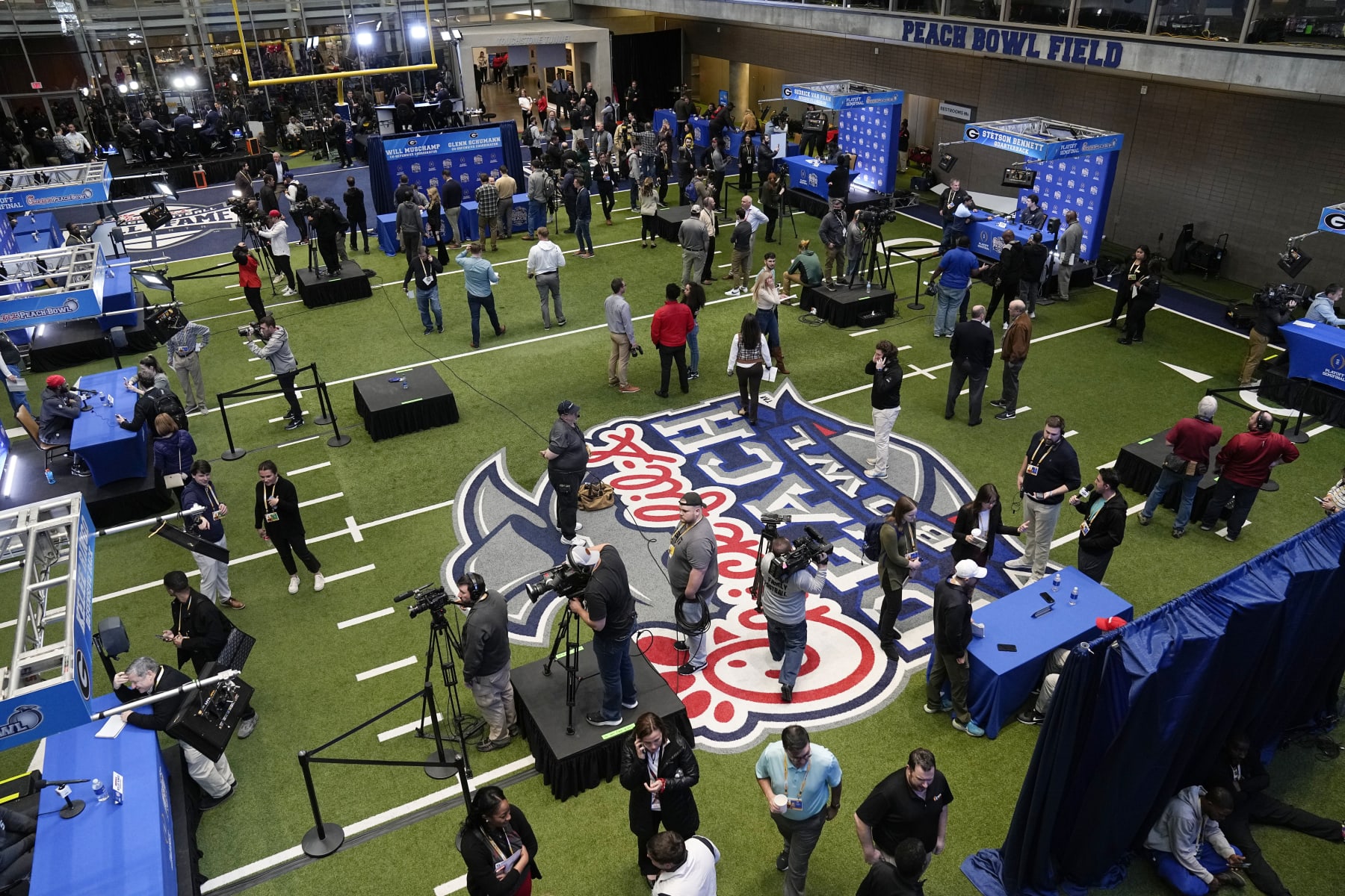 Georgia players are interviewed during media day for the Peach Bowl NCAA college football game against Ohio State, Thursday, Dec. 29, 2022, in Atlanta. (AP Photo/John Bazemore)