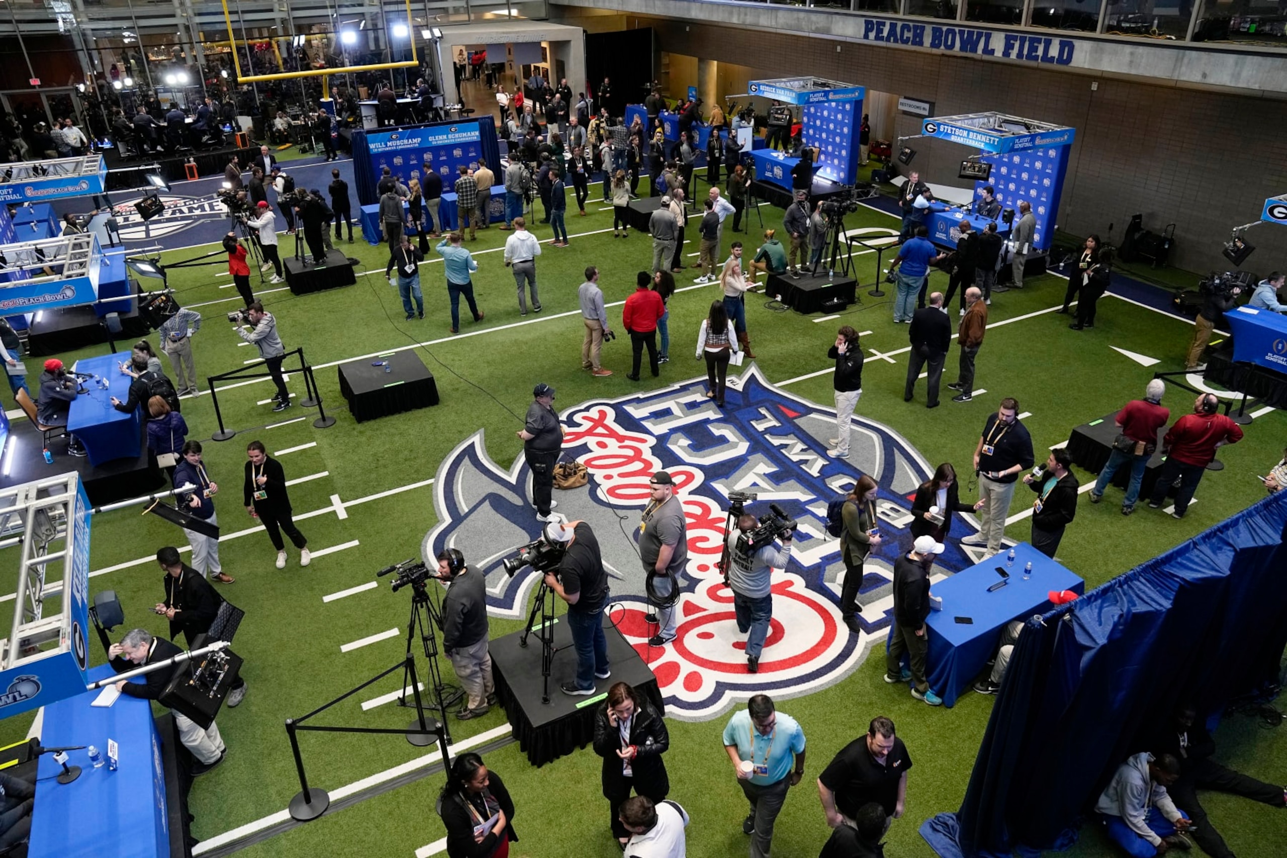 Georgia players are interviewed during media day for the Peach Bowl NCAA college football game against Ohio State, Thursday, Dec. 29, 2022, in Atlanta. (AP Photo/John Bazemore)