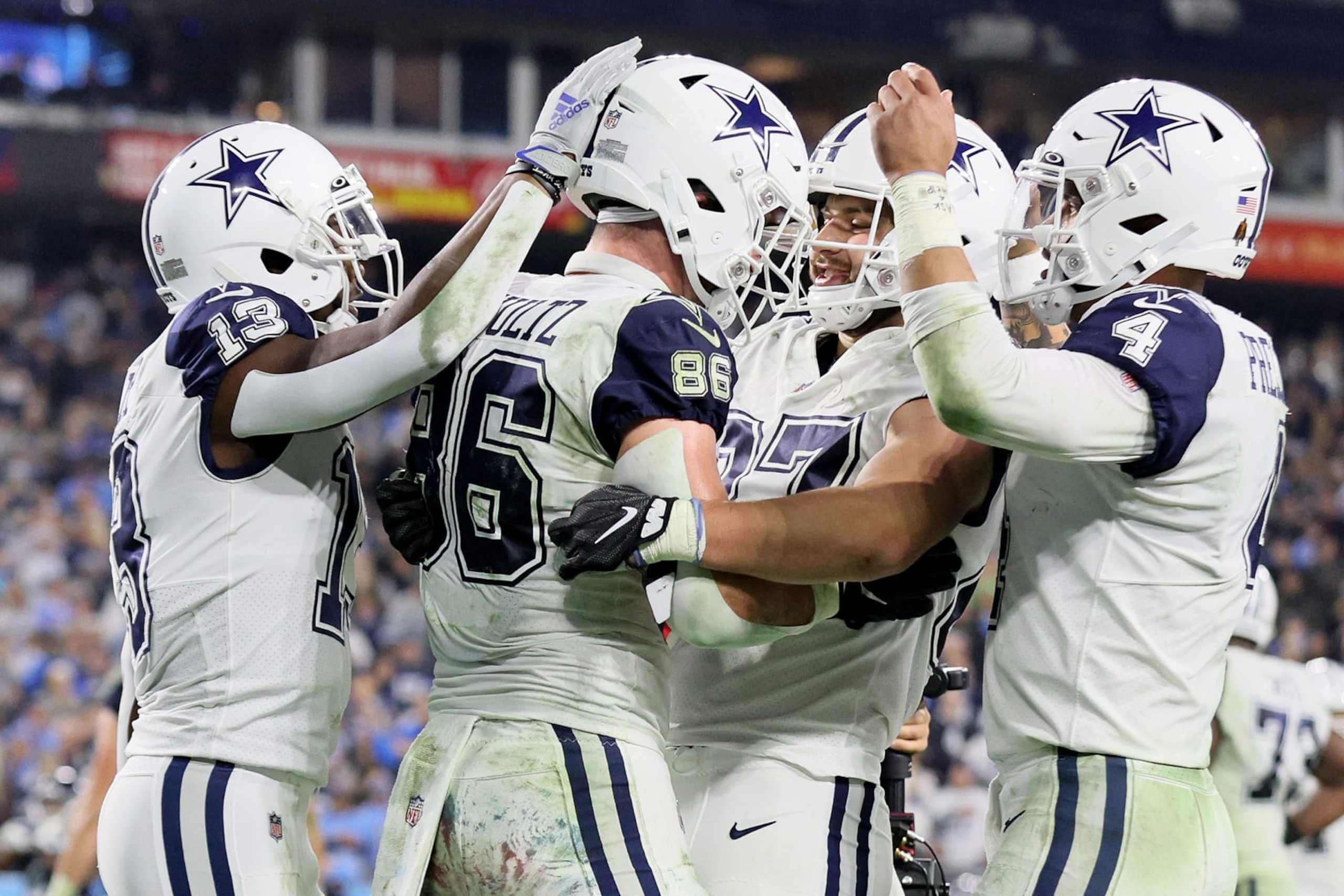 NASHVILLE, TENNESSEE - DECEMBER 29: Dalton Schultz #86 of the Dallas Cowboys celebrates with Michael Gallup #13, Jake Ferguson #87 and Dak Prescott #4 after scoring a six yard touchdown against the Tennessee Titans during the third quarter of the game at Nissan Stadium on December 29, 2022 in Nashville, Tennessee. (Photo by Andy Lyons/Getty Images) NASHVILLE, TENNESSEE - DECEMBER 29: Dalton Schultz #86 of the Dallas Cowboys celebrates with Michael Gallup #13, Jake Ferguson #87 and Dak Prescott #4 after scoring a six yard touchdown against the Tennessee Titans during the third quarter of the game at Nissan Stadium on December 29, 2022 in Nashville, Tennessee. (Photo by Andy Lyons/Getty Images)