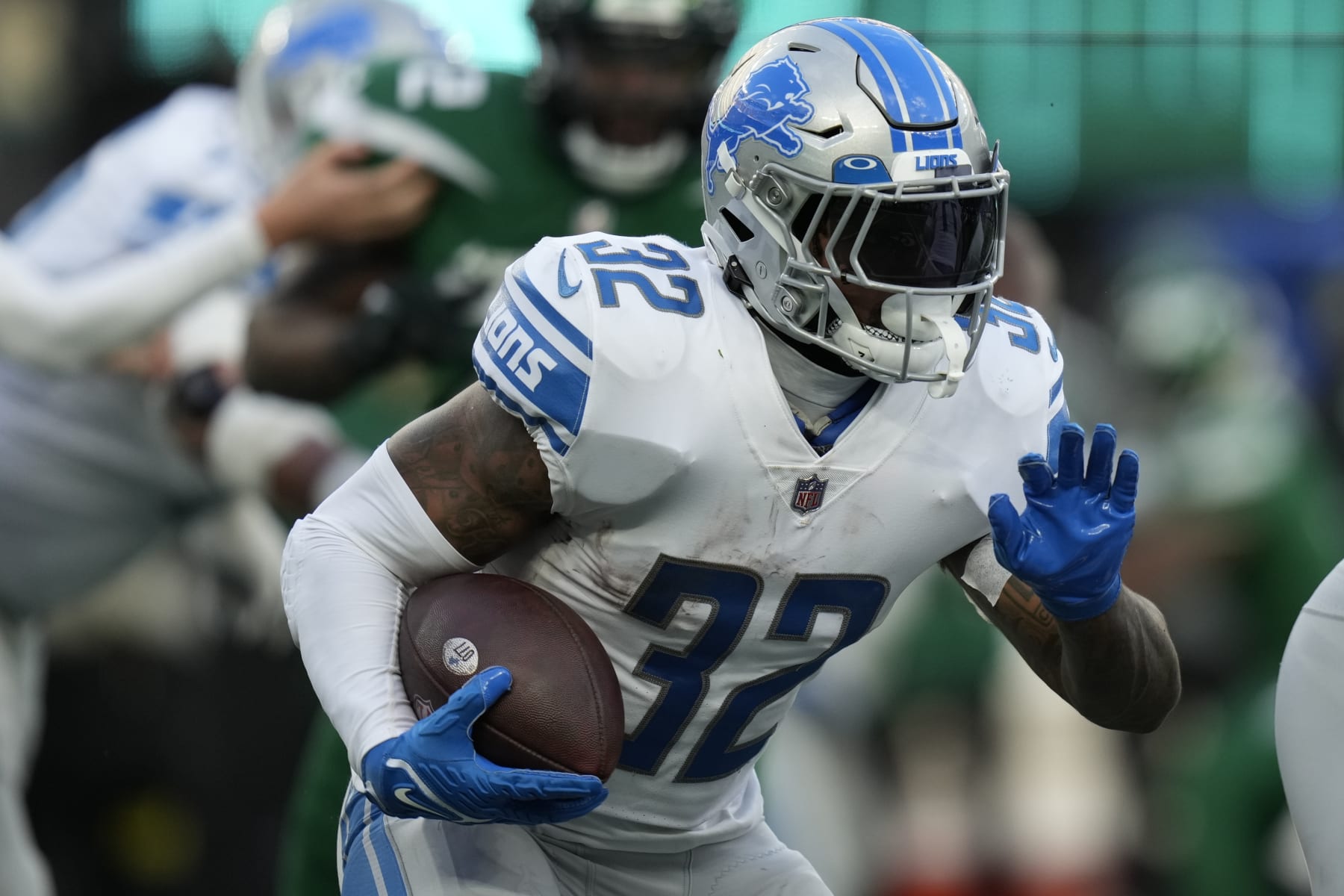 Detroit Lions running back D'Andre Swift (32) carries the ball against the New York Jets during the third quarter of an NFL football game, Sunday, Dec. 18, 2022, in East Rutherford, N.J. (AP Photo/Seth Wenig)