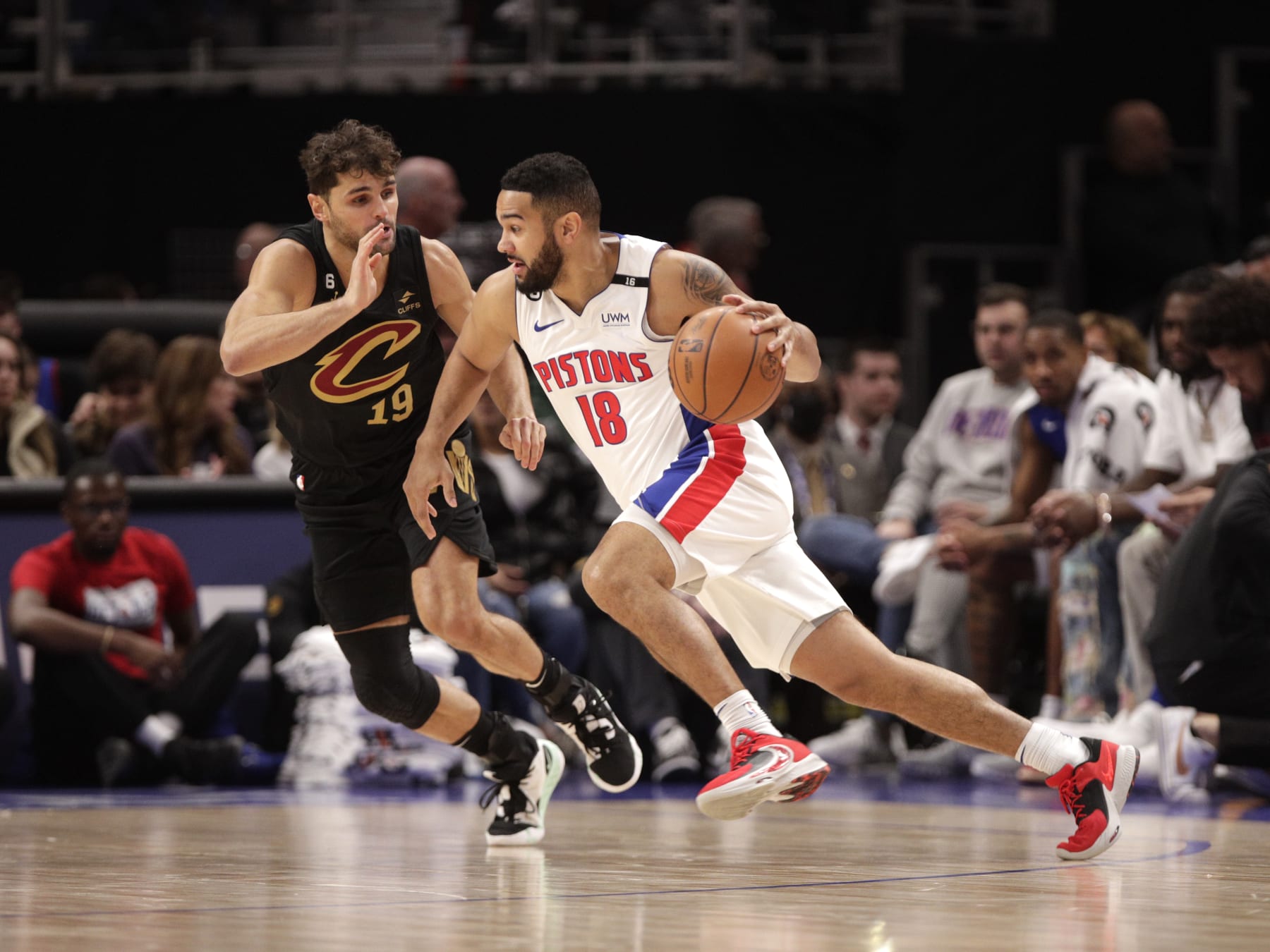 DETROIT, MI - NOVEMBER 27: Cory Joseph #18 of the Detroit Pistons moves the ball against Raul Neto #19 of the Cleveland Cavaliers on November 27, 2022 at Little Caesars Arena in Detroit, Michigan. NOTE TO USER: User expressly acknowledges and agrees that, by downloading and/or using this photograph, User is consenting to the terms and conditions of the Getty Images License Agreement. Mandatory Copyright Notice: Copyright 2022 NBAE (Photo by Brian Sevald/NBAE via Getty Images)