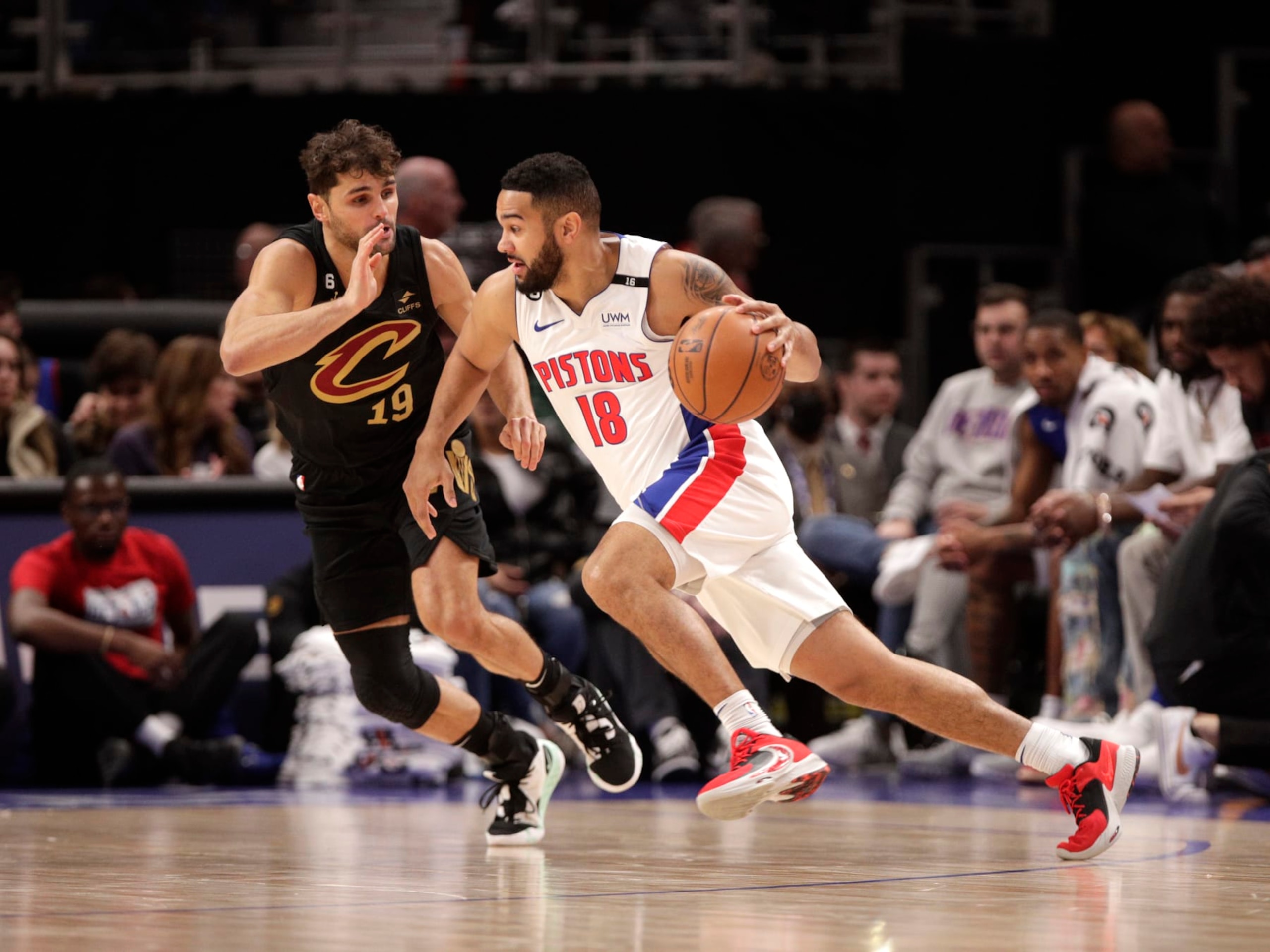 DETROIT, MI - NOVEMBER 27: Cory Joseph #18 of the Detroit Pistons moves the ball against Raul Neto #19 of the Cleveland Cavaliers on November 27, 2022 at Little Caesars Arena in Detroit, Michigan. NOTE TO USER: User expressly acknowledges and agrees that, by downloading and/or using this photograph, User is consenting to the terms and conditions of the Getty Images License Agreement. Mandatory Copyright Notice: Copyright 2022 NBAE (Photo by Brian Sevald/NBAE via Getty Images)