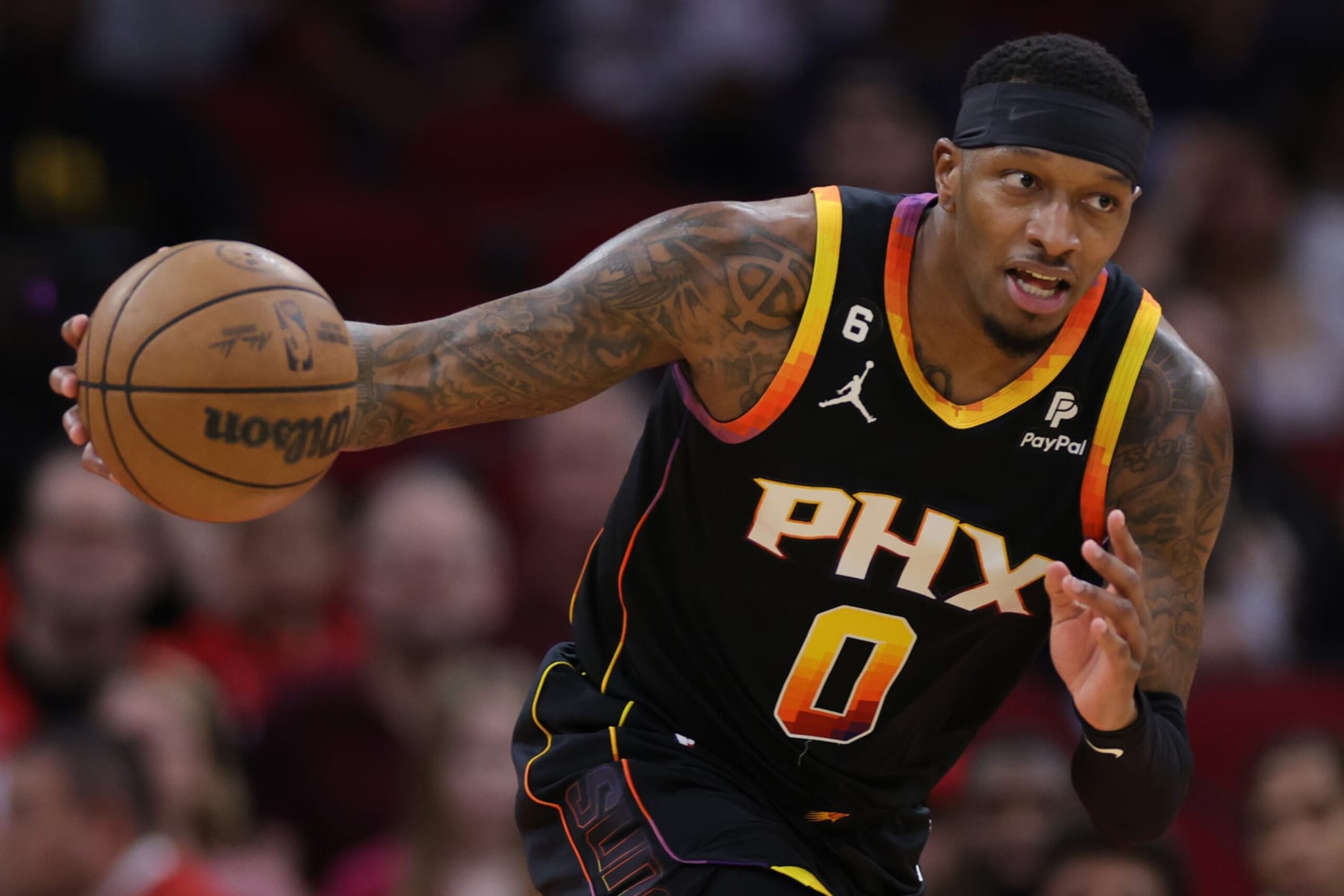 HOUSTON, TEXAS - DECEMBER 13: Torrey Craig #0 of the Phoenix Suns controls the ball against the Houston Rockets during the first half at Toyota Center on December 13, 2022 in Houston, Texas. NOTE TO USER: User expressly acknowledges and agrees that, by downloading and or using this photograph, User is consenting to the terms and conditions of the Getty Images License Agreement. (Photo by Carmen Mandato/Getty Images)