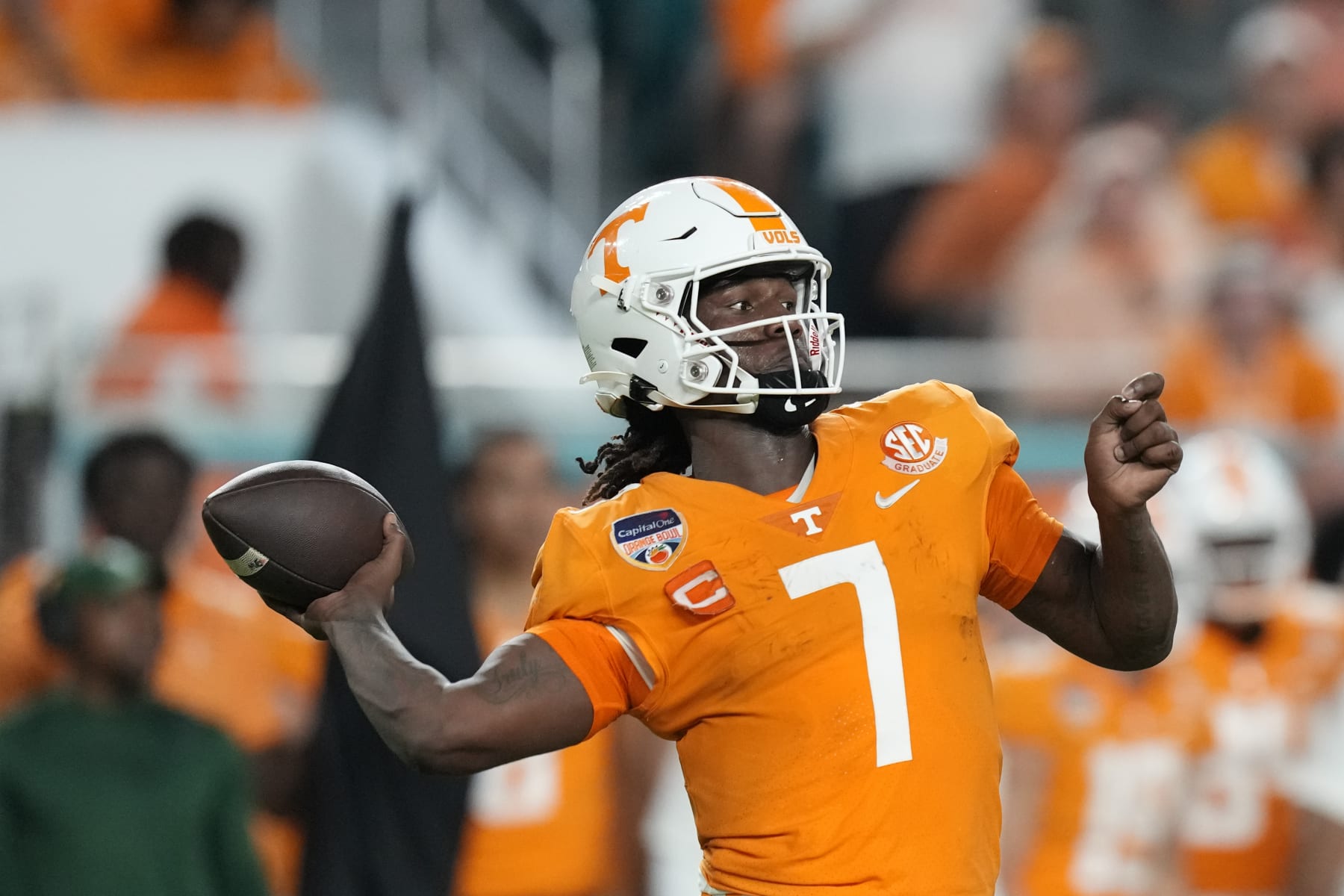 Tennessee quarterback Joe Milton III prepares to throw a pass during the first half of the team's Orange Bowl NCAA college football game against Clemson, Friday, Dec. 30, 2022, in Miami Gardens, Fla. (AP Photo/Rebecca Blackwell)