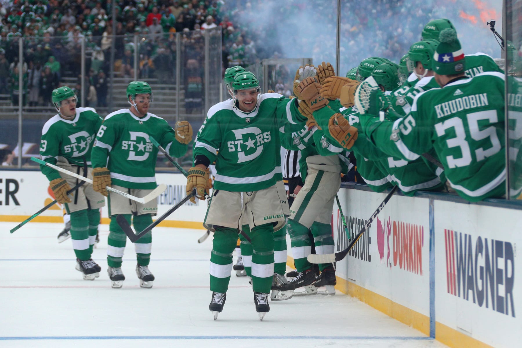 DALLAS, TEXAS - JANUARY 01: Andrej Sekera #5 of the Dallas Stars celebrate his goal with teammates on the bench during the third period of the 2020 NHL Winter Classic between the Nashville Predators and the Dallas Stars at Cotton Bowl on January 01, 2020 in Dallas, Texas. The Stars defeated the Predators 4-2.  (Photo by Dave Sandford/NHLI via Getty Images)