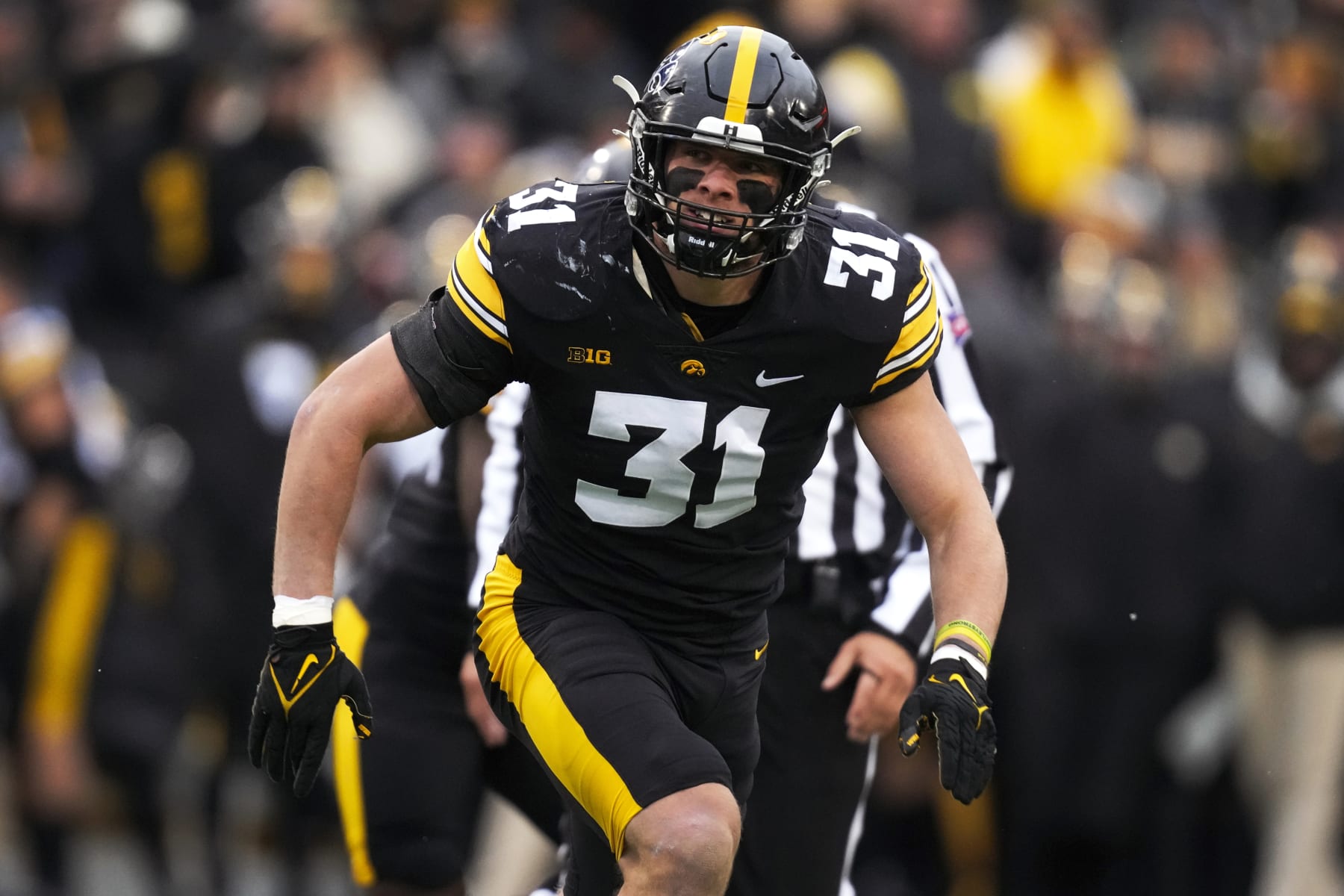 Iowa linebacker Jack Campbell runs on the field during the first half of an NCAA college football game against Wisconsin, Saturday, Nov. 12, 2022, in Iowa City, Iowa. (AP Photo/Charlie Neibergall)