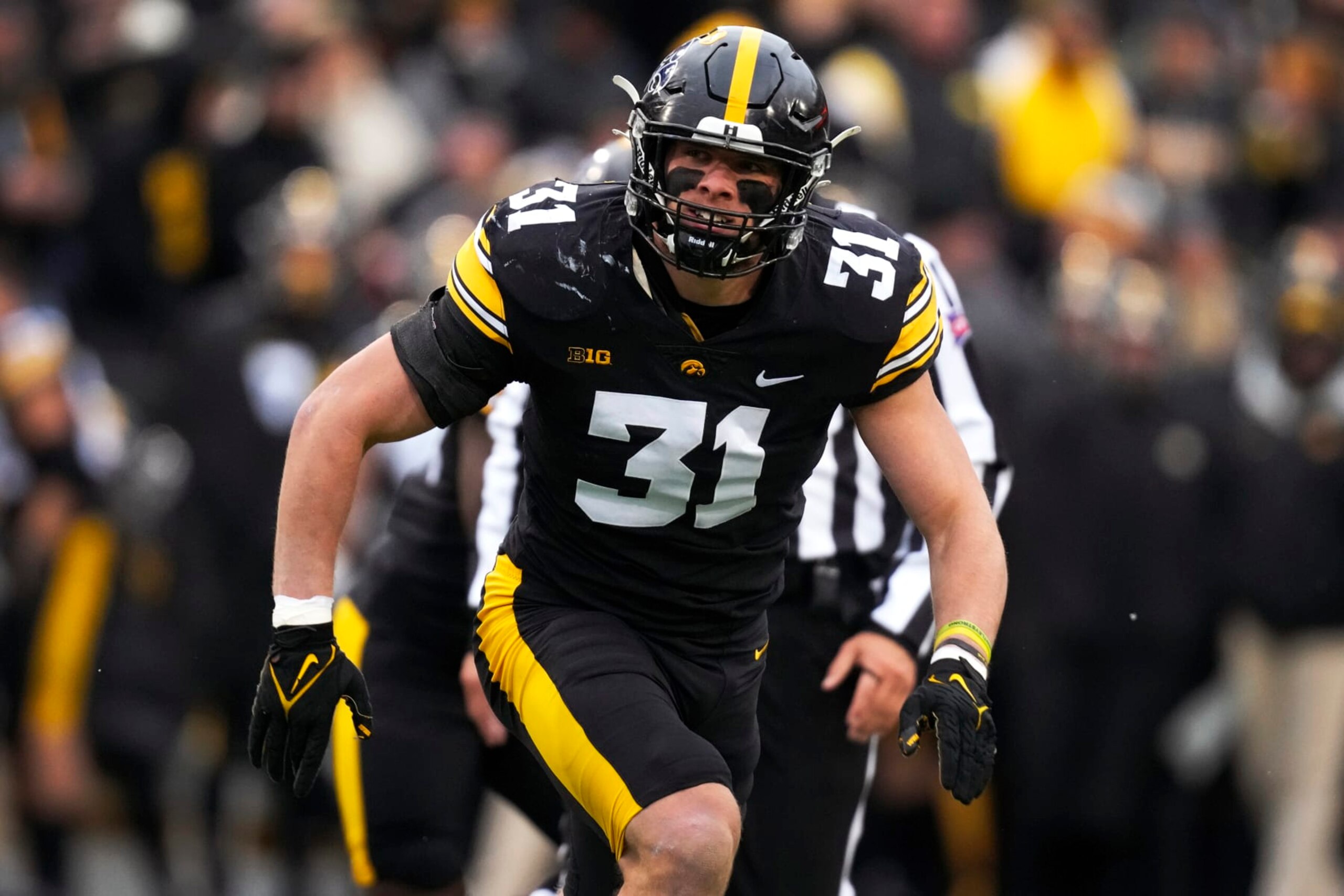 Iowa linebacker Jack Campbell runs on the field during the first half of an NCAA college football game against Wisconsin, Saturday, Nov. 12, 2022, in Iowa City, Iowa. (AP Photo/Charlie Neibergall)