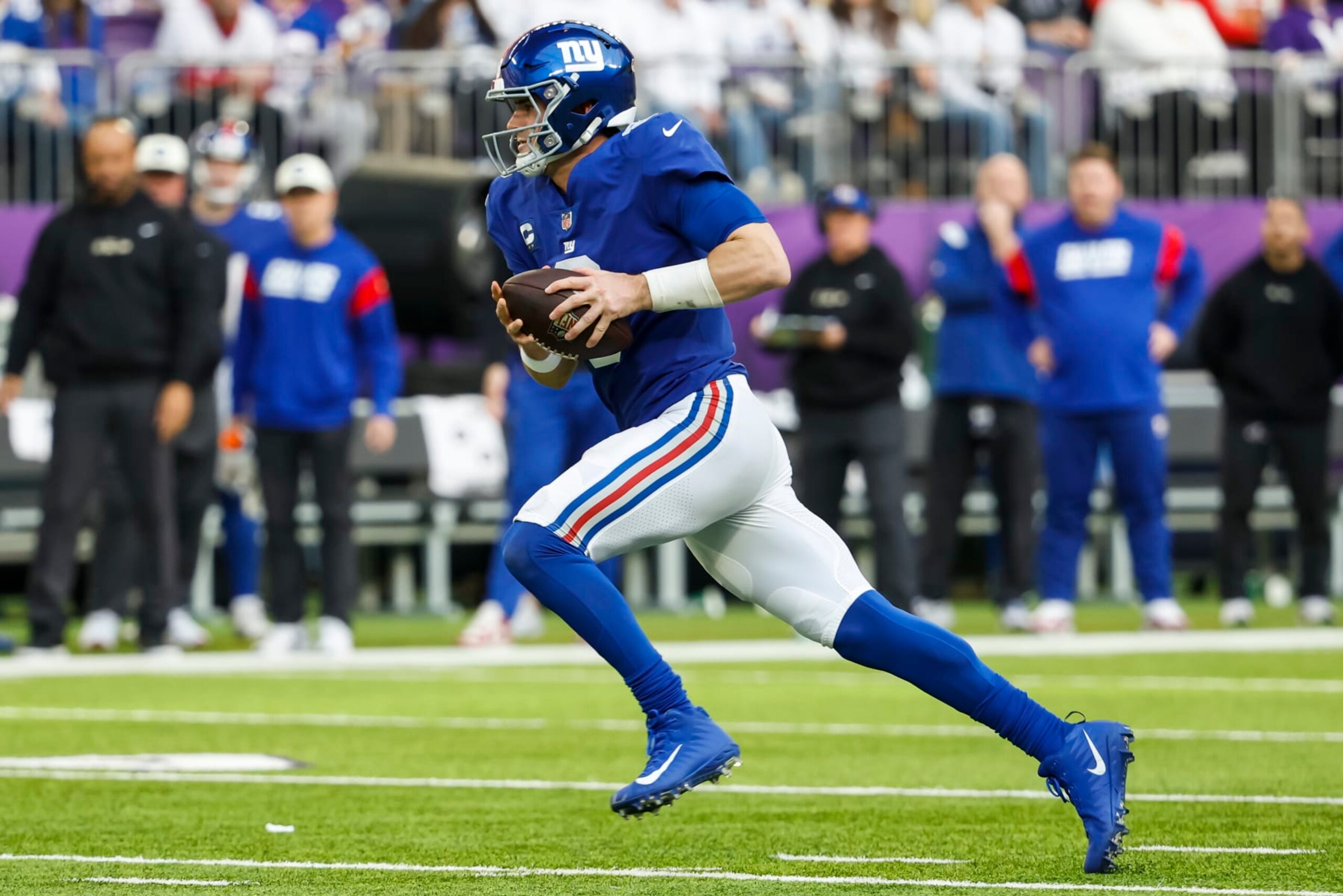 MINNEAPOLIS, MN - DECEMBER 24: Daniel Jones #8 of the New York Giants runs with the ball against the Minnesota Vikings in the second quarter of the game at U.S. Bank Stadium on December 24, 2022 in Minneapolis, Minnesota. The Vikings defeated the Giants 27-24. (Photo by David Berding/Getty Images) MINNEAPOLIS, MN - DECEMBER 24: Daniel Jones #8 of the New York Giants runs with the ball against the Minnesota Vikings in the second quarter of the game at U.S. Bank Stadium on December 24, 2022 in Minneapolis, Minnesota. The Vikings defeated the Giants 27-24. (Photo by David Berding/Getty Images)