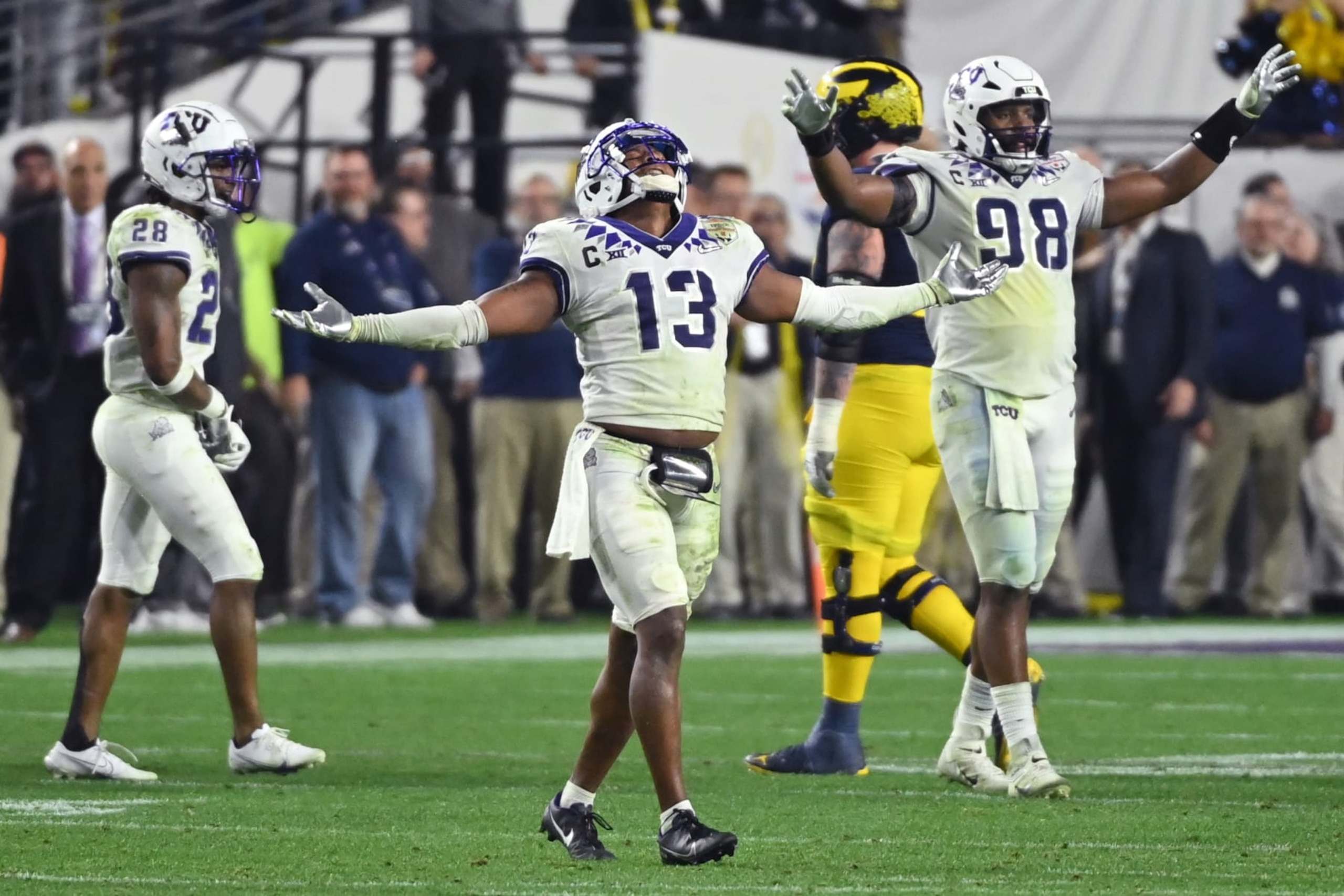 GLENDALE, ARIZONA - DECEMBER 31: Dee Winters #13 of the TCU Horned Frogs celebrates after a fourth down stop during the fourth quarter against the Michigan Wolverines in the Vrbo Fiesta Bowl at State Farm Stadium on December 31, 2022 in Glendale, Arizona. (Photo by Norm Hall/Getty Images)
