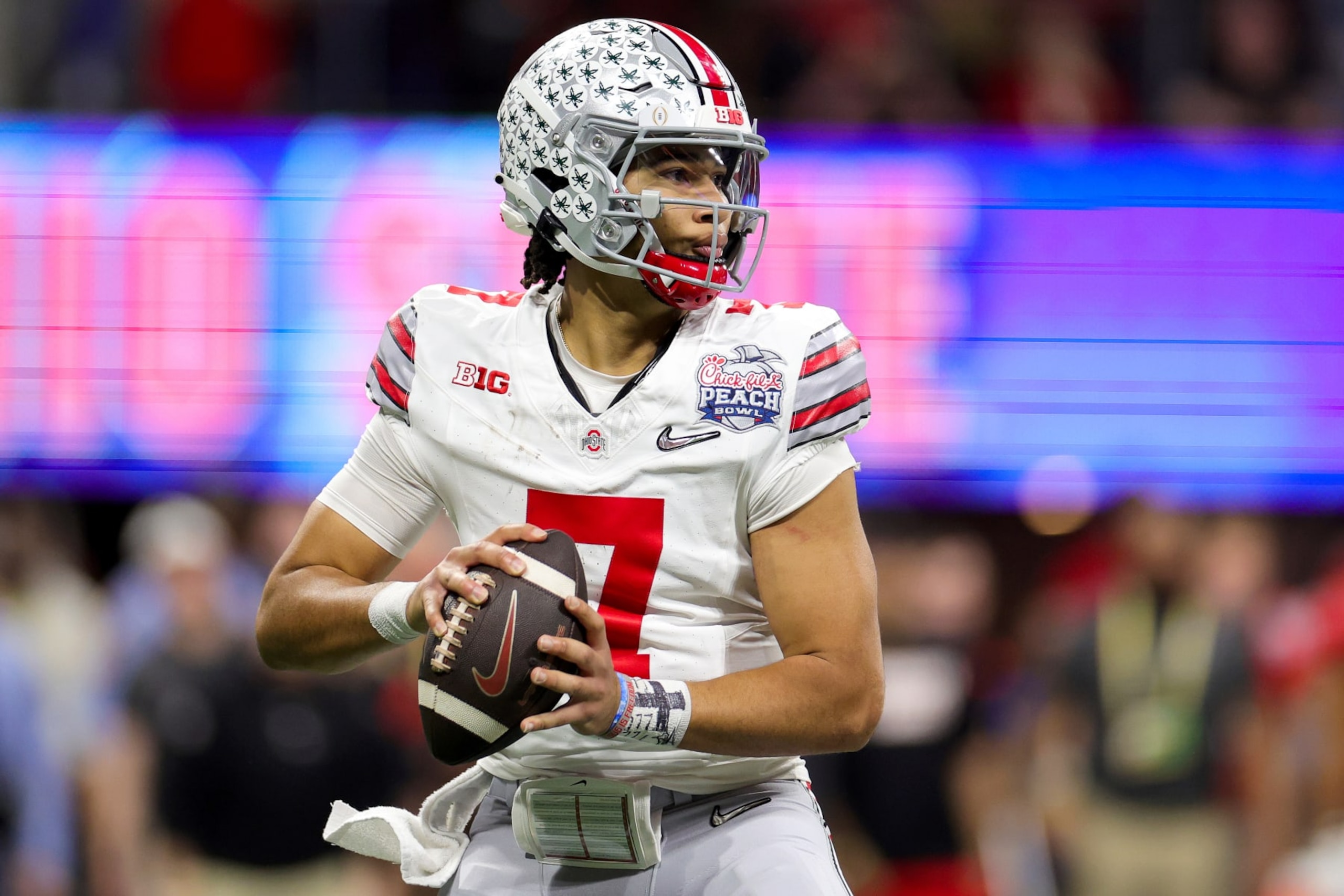 ATLANTA, GEORGIA - DECEMBER 31: C.J. Stroud #7 of the Ohio State Buckeyes looks to pass during the second quarter against the Georgia Bulldogs in the Chick-fil-A Peach Bowl at Mercedes-Benz Stadium on December 31, 2022 in Atlanta, Georgia. (Photo by Carmen Mandato/Getty Images)