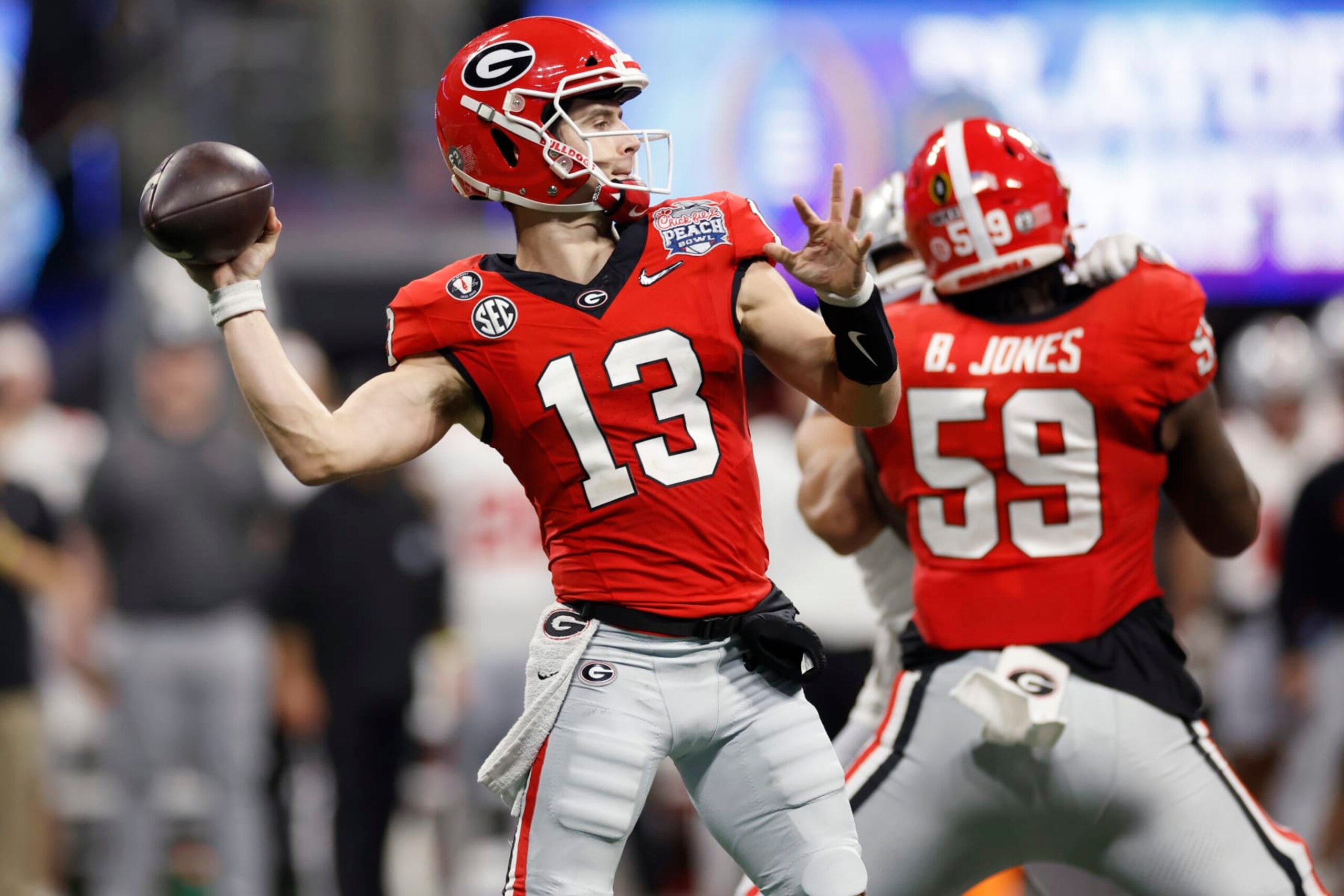 ATLANTA, GA - DECEMBER 31: Georgia Bulldogs quarterback Stetson Bennett (13) passes the ball during the Chick-fil-A Peach Bowl semifinal game against the Ohio State Buckeyes on December 31, 2022 at Mercedes-Benz Stadium in Atlanta, Georgia. (Photo by Joe Robbins/Icon Sportswire via Getty Images) ATLANTA, GA - DECEMBER 31: Georgia Bulldogs quarterback Stetson Bennett (13) passes the ball during the Chick-fil-A Peach Bowl semifinal game against the Ohio State Buckeyes on December 31, 2022 at Mercedes-Benz Stadium in Atlanta, Georgia. (Photo by Joe Robbins/Icon Sportswire via Getty Images)