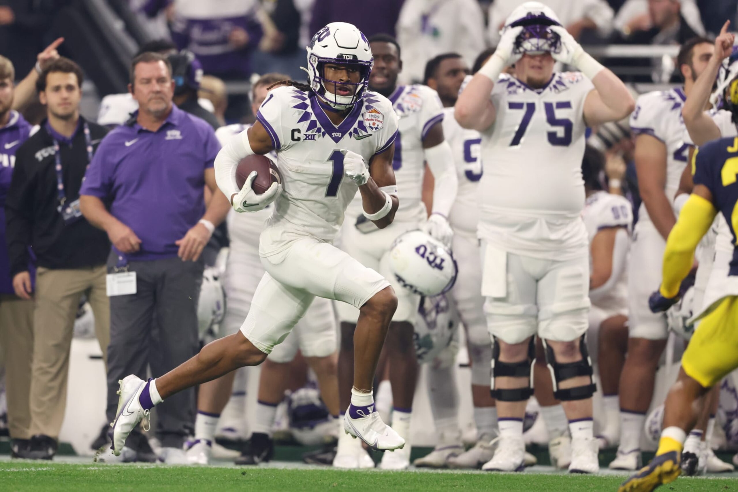 GLENDALE, ARIZONA - DECEMBER 31: Quentin Johnston #1 of the TCU Horned Frogs runs after catching a pass during the second quarter in the Vrbo Fiesta Bowl at State Farm Stadium on December 31, 2022 in Glendale, Arizona. (Photo by Christian Petersen/Getty Images) GLENDALE, ARIZONA - DECEMBER 31: Quentin Johnston #1 of the TCU Horned Frogs runs after catching a pass during the second quarter in the Vrbo Fiesta Bowl at State Farm Stadium on December 31, 2022 in Glendale, Arizona. (Photo by Christian Petersen/Getty Images)