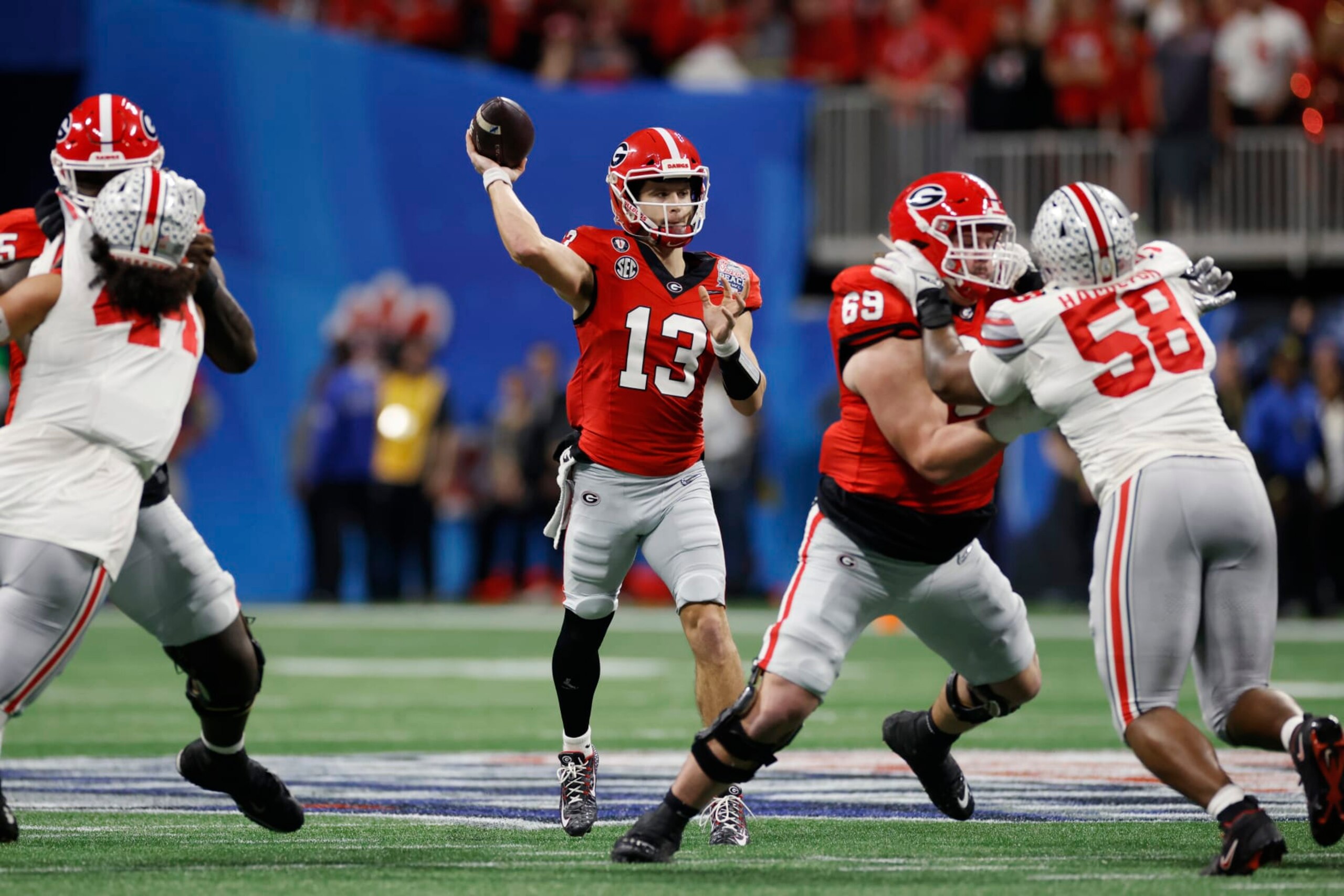 ATLANTA, GA - DECEMBER 31: Georgia Bulldogs quarterback Stetson Bennett (13) passes the ball during the Chick-fil-A Peach Bowl semifinal game against the Ohio State Buckeyes on December 31, 2022 at Mercedes-Benz Stadium in Atlanta, Georgia. (Photo by Joe Robbins/Icon Sportswire via Getty Images) ATLANTA, GA - DECEMBER 31: Georgia Bulldogs quarterback Stetson Bennett (13) passes the ball during the Chick-fil-A Peach Bowl semifinal game against the Ohio State Buckeyes on December 31, 2022 at Mercedes-Benz Stadium in Atlanta, Georgia. (Photo by Joe Robbins/Icon Sportswire via Getty Images)