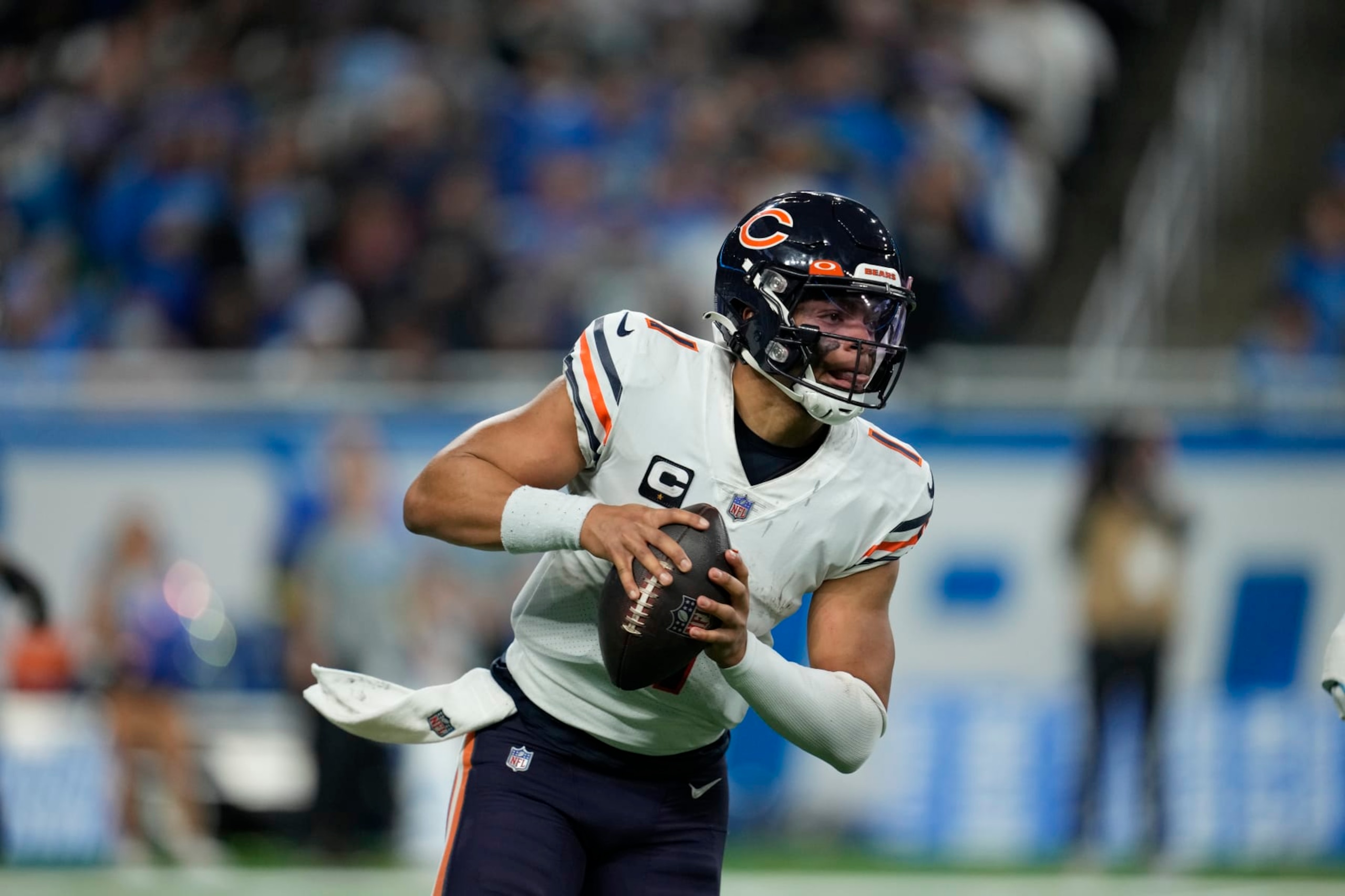 Chicago Bears quarterback Justin Fields plays during the second half of an NFL football game against the Detroit Lions, Sunday, Jan. 1, 2023, in Detroit. (AP Photo/Paul Sancya)