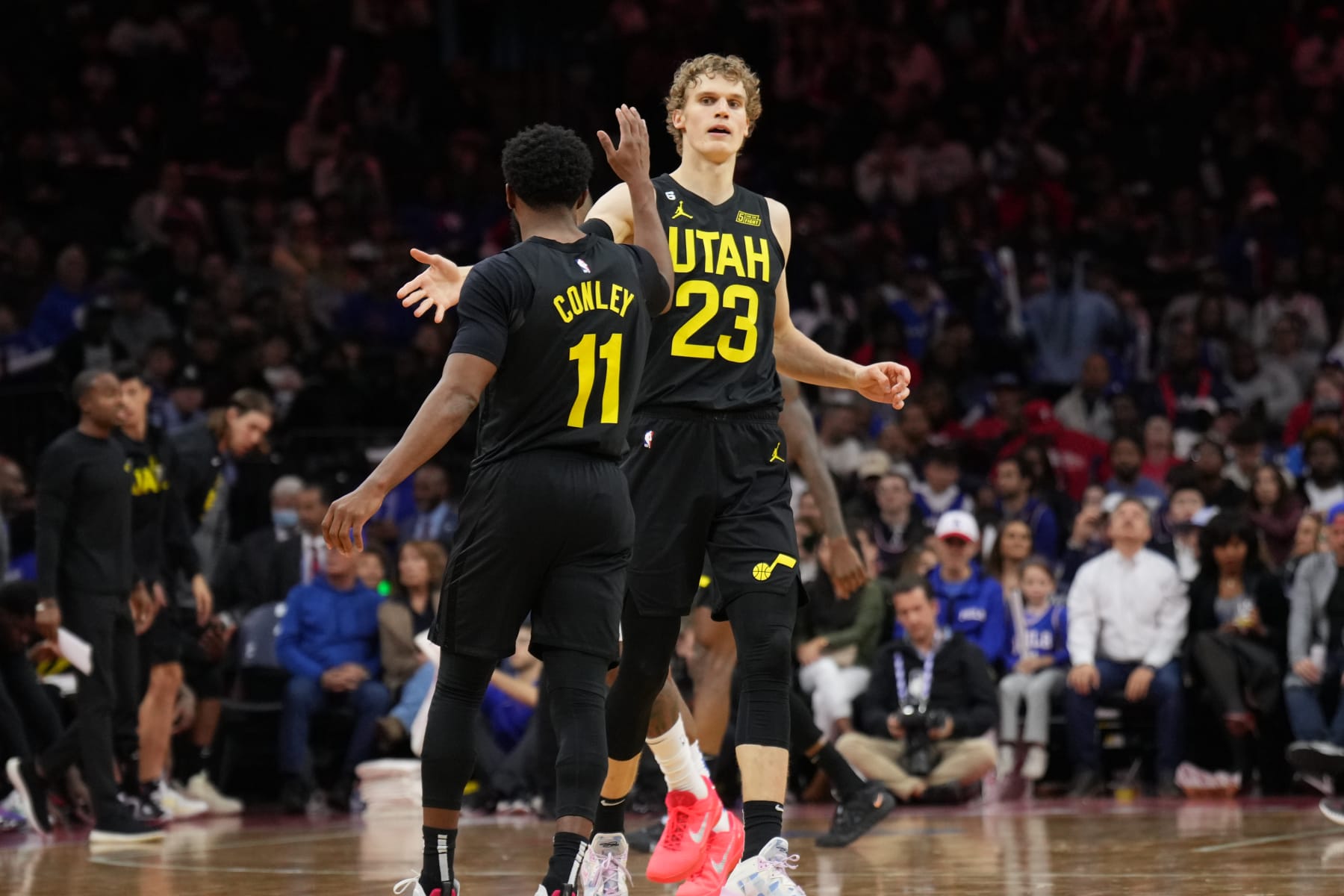 PHILADELPHIA, PA - NOVEMBER 13: Mike Conley #11 and Lauri Markkanen #23 of the Utah Jazz high five during the game against the Philadelphia 76ers on November 13, 2022 at the Wells Fargo Center in Philadelphia, Pennsylvania NOTE TO USER: User expressly acknowledges and agrees that, by downloading and/or using this Photograph, user is consenting to the terms and conditions of the Getty Images License Agreement. Mandatory Copyright Notice: Copyright 2022 NBAE (Photo by Jesse D. Garrabrant/NBAE via Getty Images)