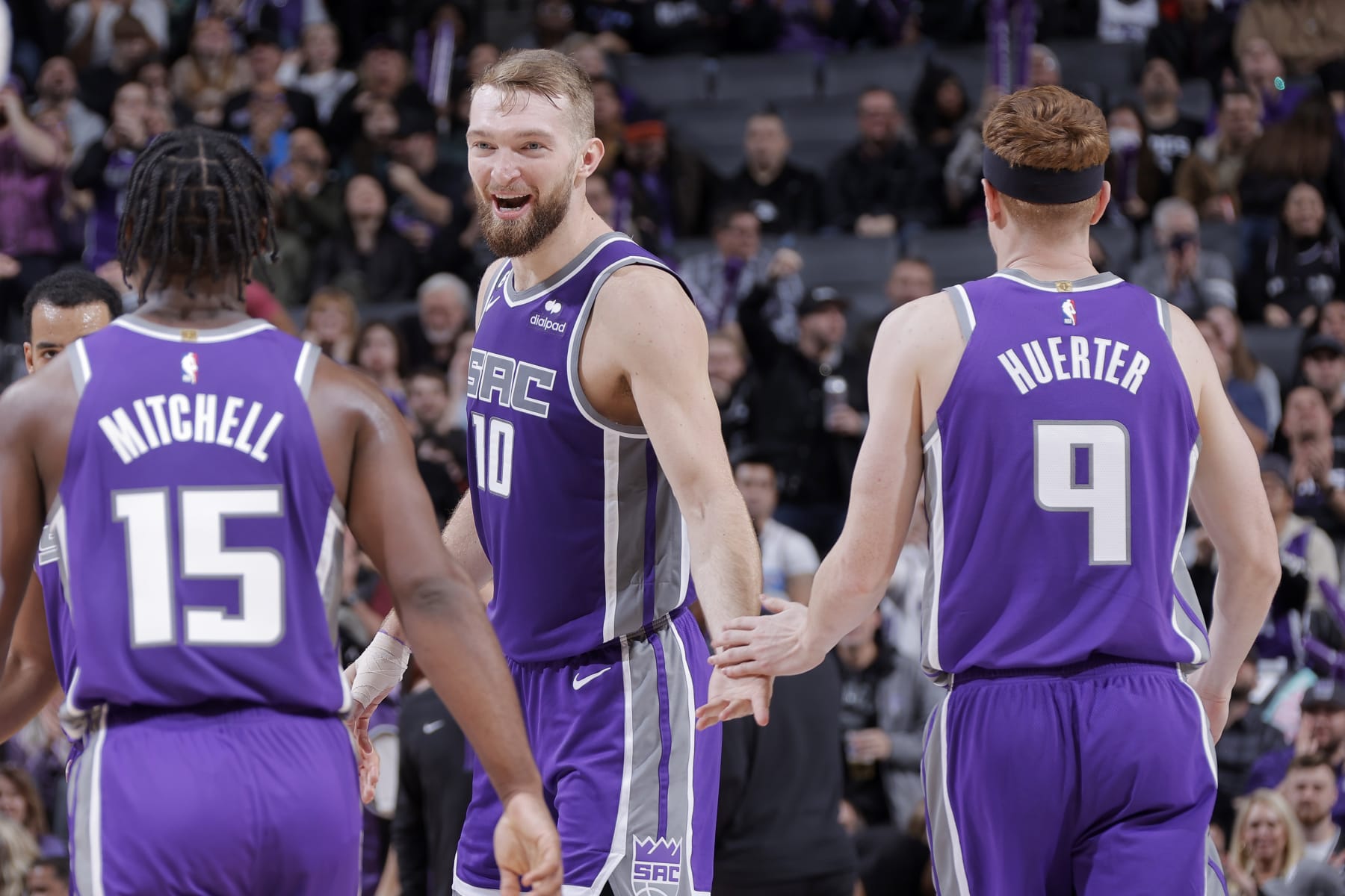 Davion Mitchell, Domantas Sabonis and Kevin Huerter