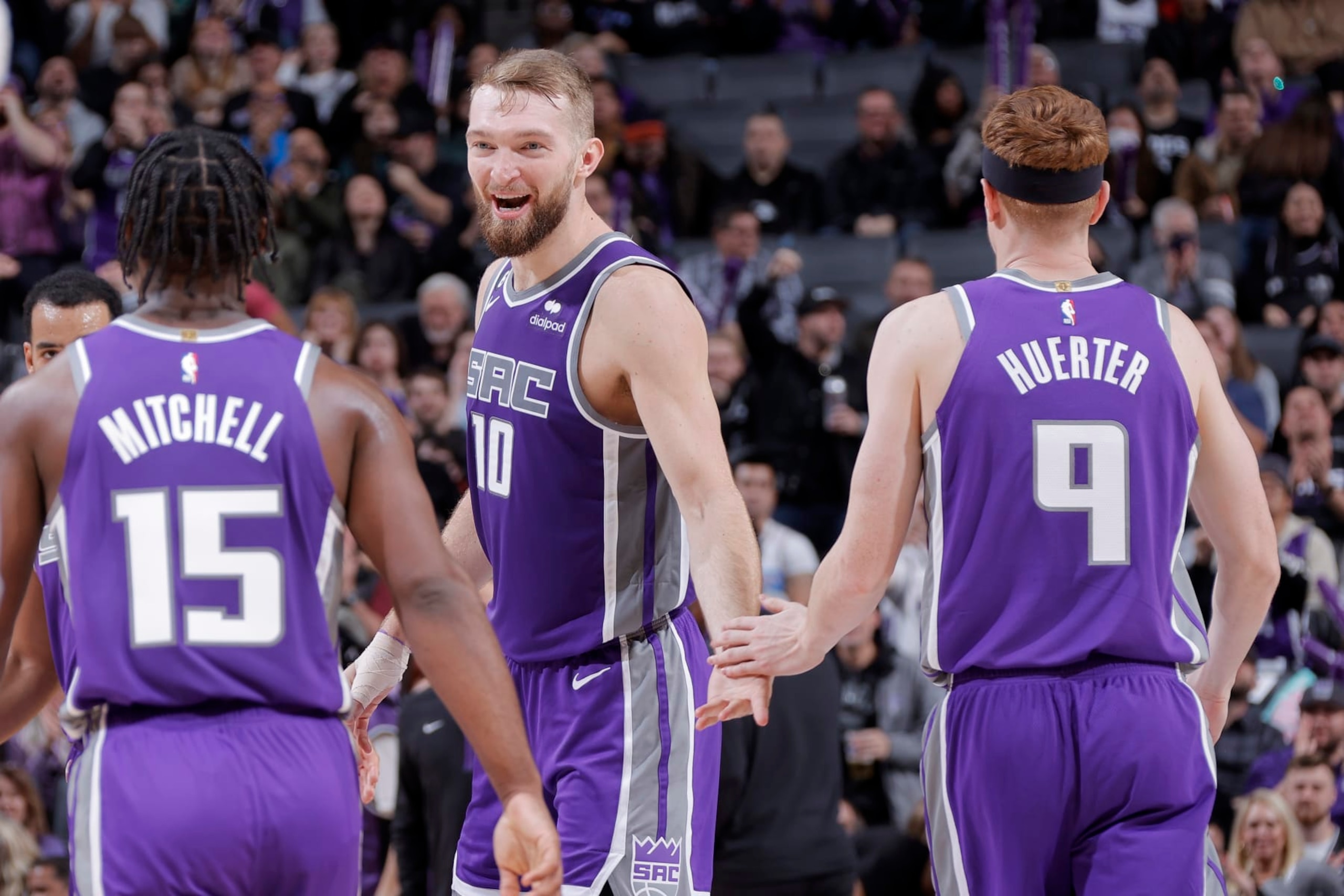 Davion Mitchell, Domantas Sabonis and Kevin Huerter