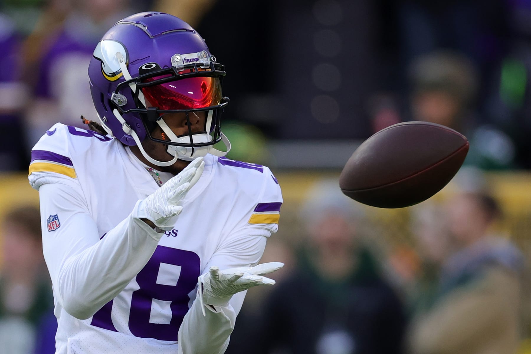 GREEN BAY, WISCONSIN - JANUARY 01: Justin Jefferson #18 of the Minnesota Vikings warms up prior to a game against the Green Bay Packers at Lambeau Field on January 01, 2023 in Green Bay, Wisconsin. (Photo by Stacy Revere/Getty Images)