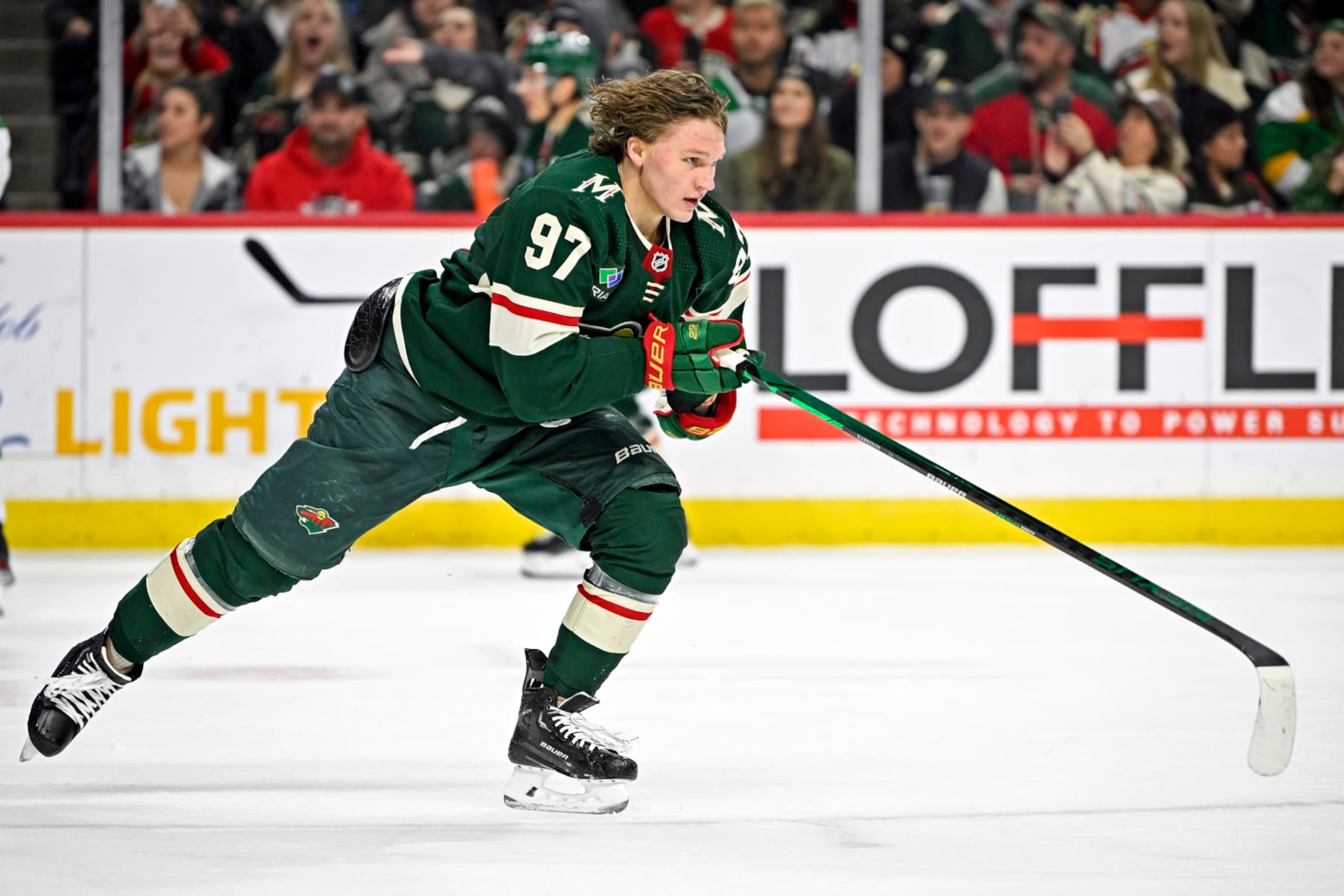ST. PAUL, MN - DECEMBER 29: Minnesota Wild Left Wing Kirill Kaprizov (97) skates to the bench after his helmet is removed from his head by a member of the Dallas Stars during the second period of a game between the Minnesota Wild and Dallas Stars on December 29, 2022, at Xcel Energy Center in St. Paul, MN.(Photo by Nick Wosika/Icon Sportswire via Getty Images)