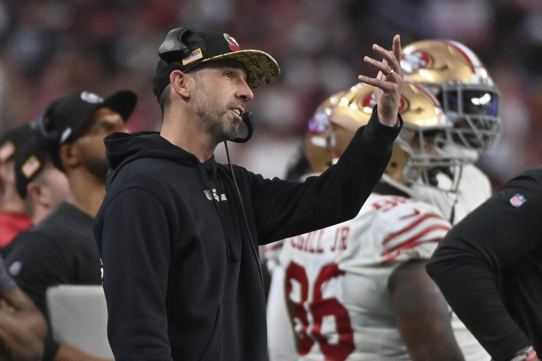 San Francisco 49ers head coach Kyle Shanahan watches a replay during the first half of an NFL football game between the San Francisco 49ers and Las Vegas Raiders, Sunday, Jan. 1, 2023, in Las Vegas. (AP Photo/David Becker)