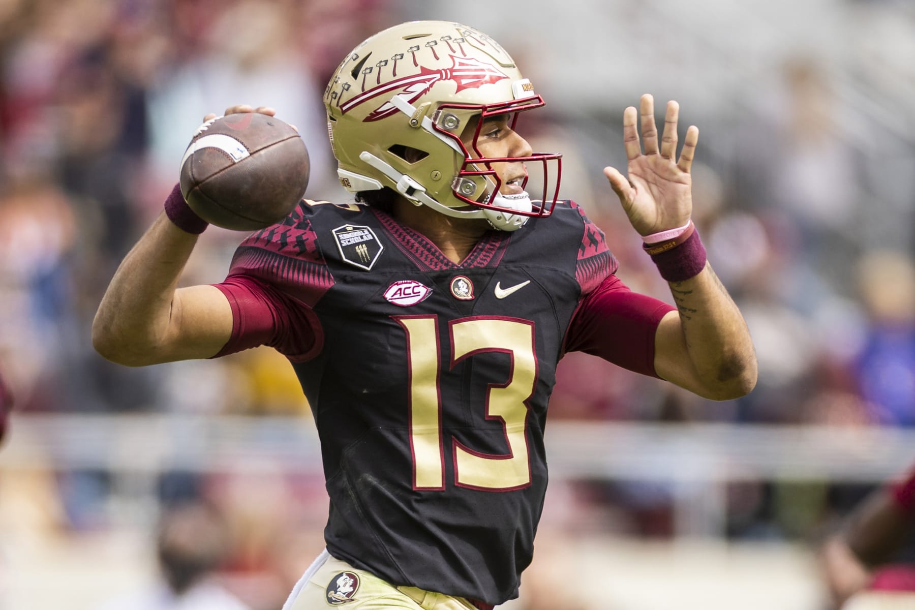 TALLAHASSEE, FLORIDA - NOVEMBER 19: Jordan Travis #13 of the Florida State Seminoles throws a pass during the first half of a game against the Louisiana-Lafayette Ragin Cajuns at Doak Campbell Stadium on November 19, 2022 in Tallahassee, Florida. (Photo by James Gilbert/Getty Images)