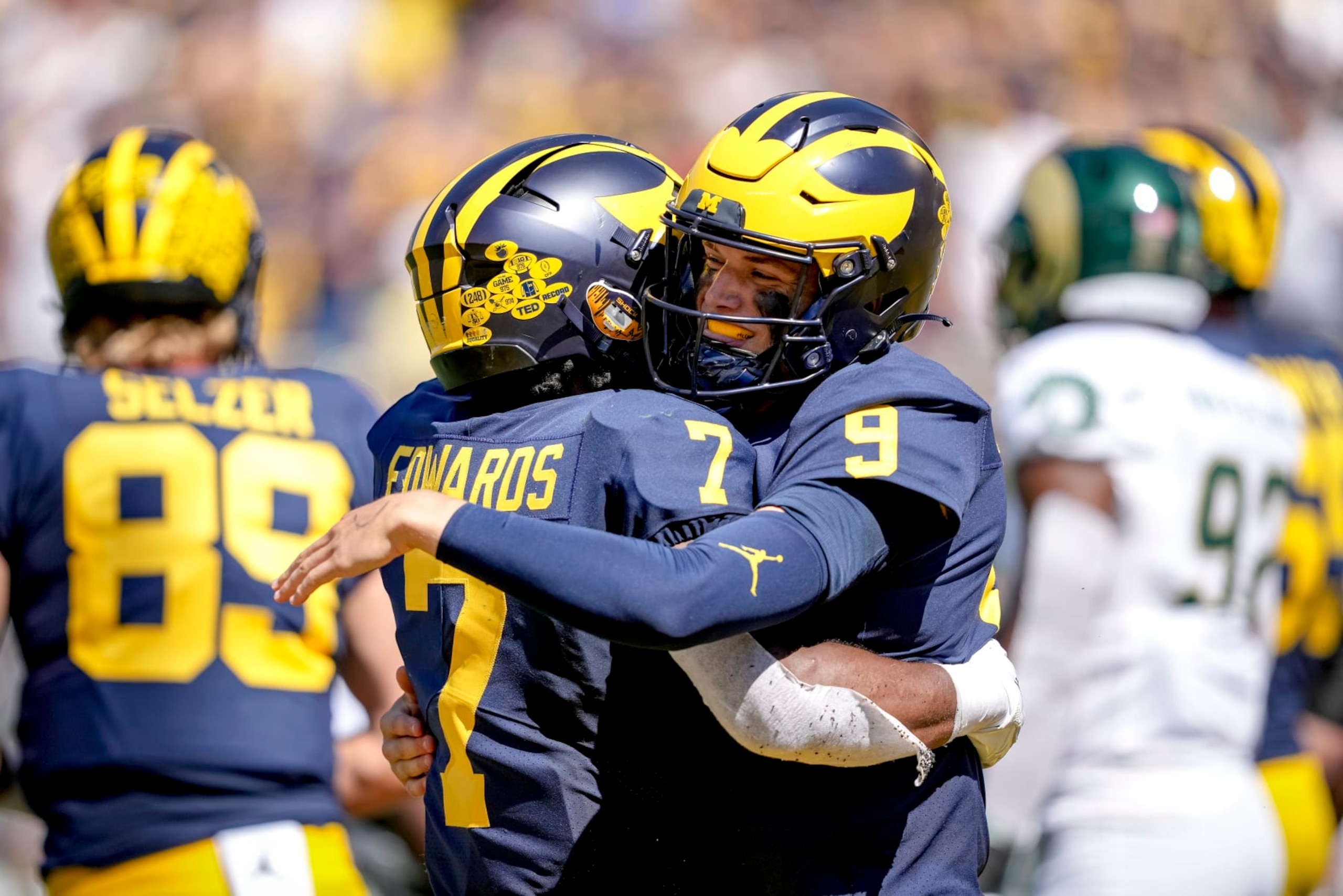 ANN ARBOR, MICHIGAN - SEPTEMBER 03: Donovan Edwards #7 of the Michigan Wolverines and J.J. McCarthy #9 of the Michigan Wolverines embrace after McCarthy scored a touchdown against the Colorado State Rams during the second half at Michigan Stadium on September 03, 2022 in Ann Arbor, Michigan. (Photo by Nic Antaya/Getty Images) ANN ARBOR, MICHIGAN - SEPTEMBER 03: Donovan Edwards #7 of the Michigan Wolverines and J.J. McCarthy #9 of the Michigan Wolverines embrace after McCarthy scored a touchdown against the Colorado State Rams during the second half at Michigan Stadium on September 03, 2022 in Ann Arbor, Michigan. (Photo by Nic Antaya/Getty Images)