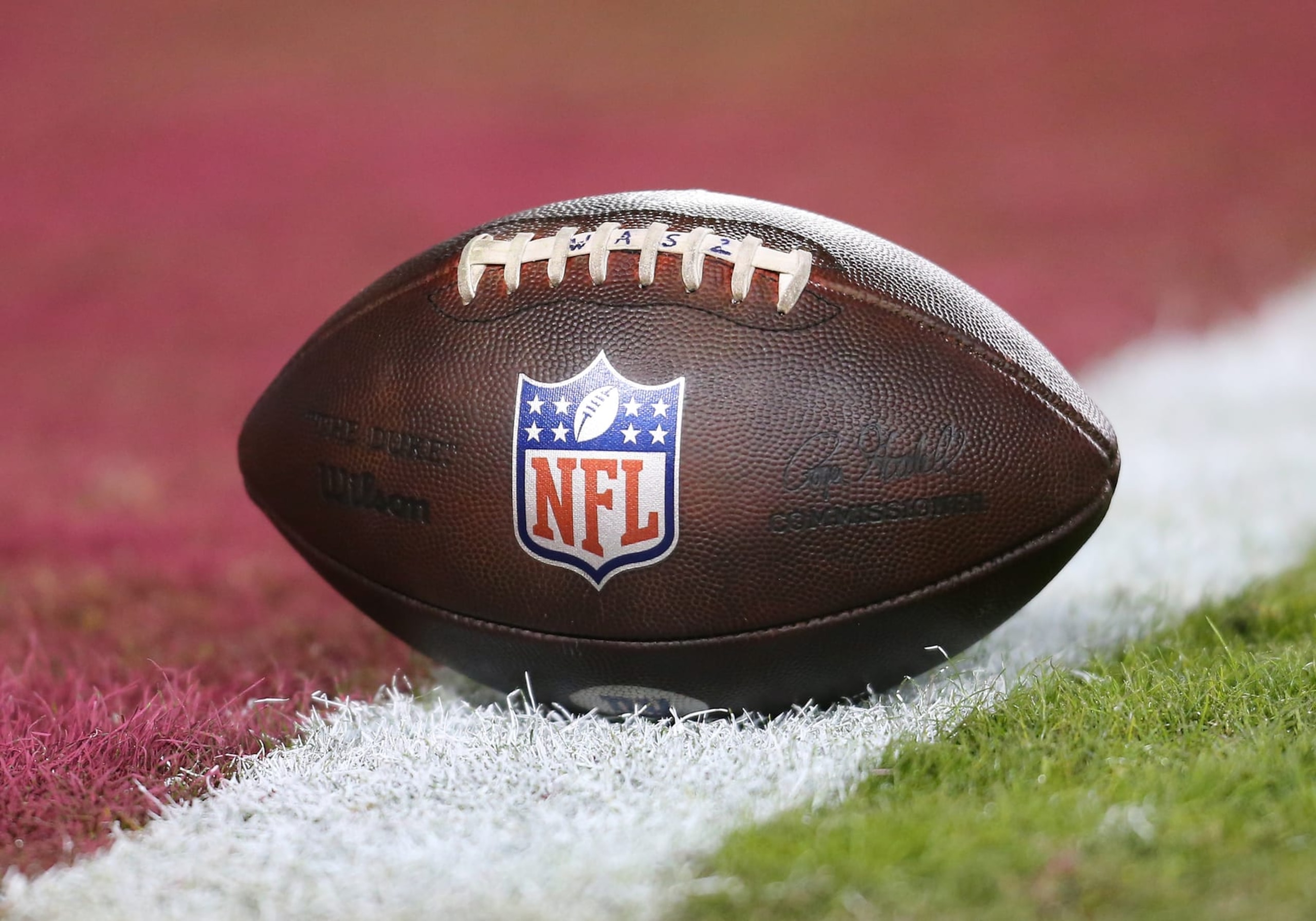 LANDOVER, MD - DECEMBER 18: .Football woth NFL logo resting on the field prior to the New York Giants game versus the Washington Commanders on December 18, 2022, at FedEx Field in Landover, MD. (Photo by Lee Coleman/Icon Sportswire via Getty Images) LANDOVER, MD - DECEMBER 18: .Football woth NFL logo resting on the field prior to the New York Giants game versus the Washington Commanders on December 18, 2022, at FedEx Field in Landover, MD. (Photo by Lee Coleman/Icon Sportswire via Getty Images)