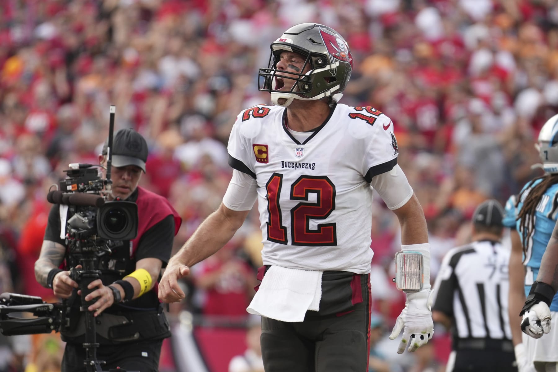 Tampa Bay Buccaneers quarterback Tom Brady (12) celebrates after his rushing touchdown during an NFL football game against the Carolina Panthers, Sunday, January 1, 2023, in Tampa, Fla. (AP Photo/Peter Joneleit)