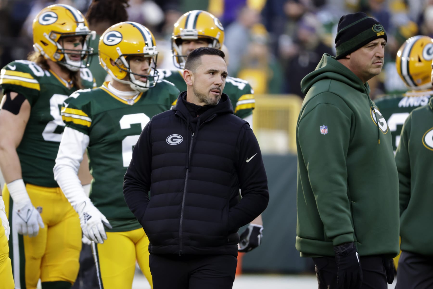 Green Bay Packers head coach Matt LaFleur, center, watches his team warmup before an NFL football game against the Minnesota Vikings, Sunday, Jan. 1, 2023, in Green Bay, Wis. (AP Photo/Mike Roemer)