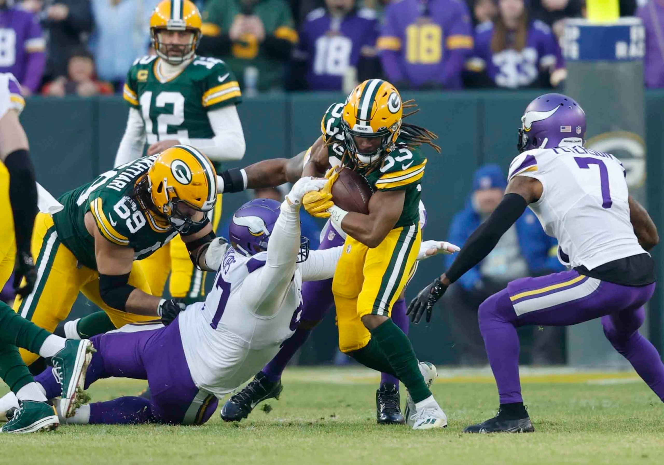 Green Bay Packers running back Aaron Jones (33) runs the ball against the Minnesota Vikings during an NFL football game Sunday, Jan. 1, 2023, in Green Bay, Wis. (AP Photo/Jeffrey Phelps)
