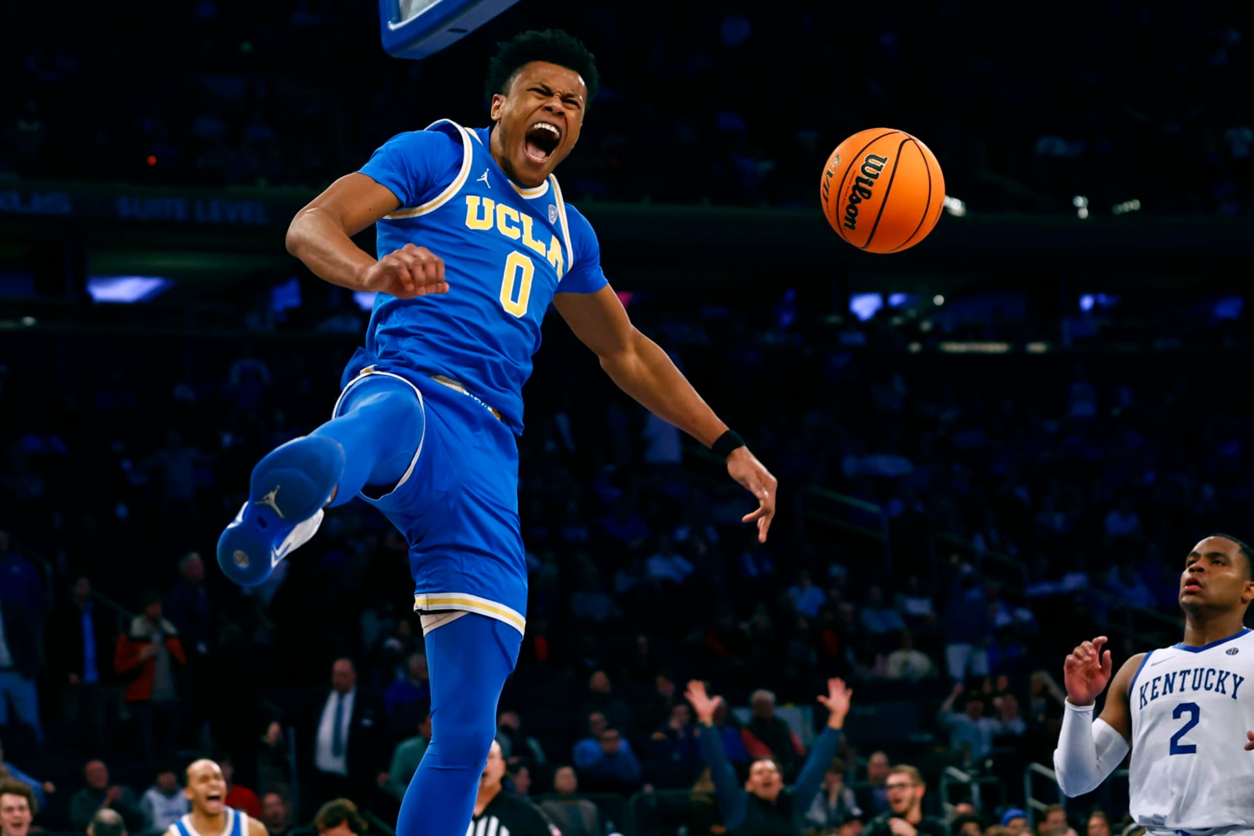 NEW YORK, NY - DECEMBER 17: Jaylen Clark #0 of the UCLA Bruins reacts after he dunks against the Kentucky Wildcats during the second half of a game in the CBS Sports Classic at Madison Square Garden on December 17, 2022 in New York City. UCLA defeated Kentucky 63-53. (Photo by Rich Schultz/Getty Images)