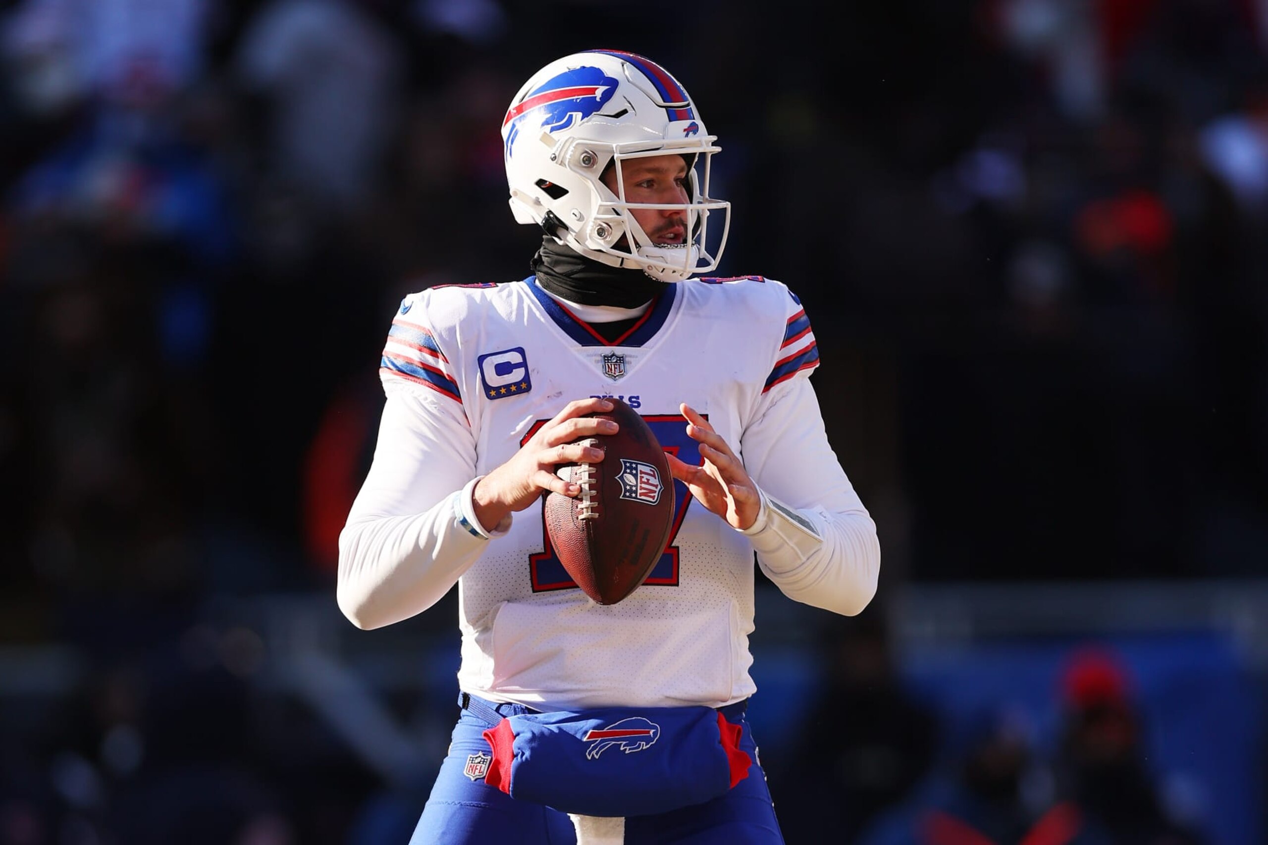 CHICAGO, ILLINOIS - DECEMBER 24: Josh Allen #17 of the Buffalo Bills looks to pass against the Chicago Bears at Soldier Field on December 24, 2022 in Chicago, Illinois. (Photo by Michael Reaves/Getty Images)