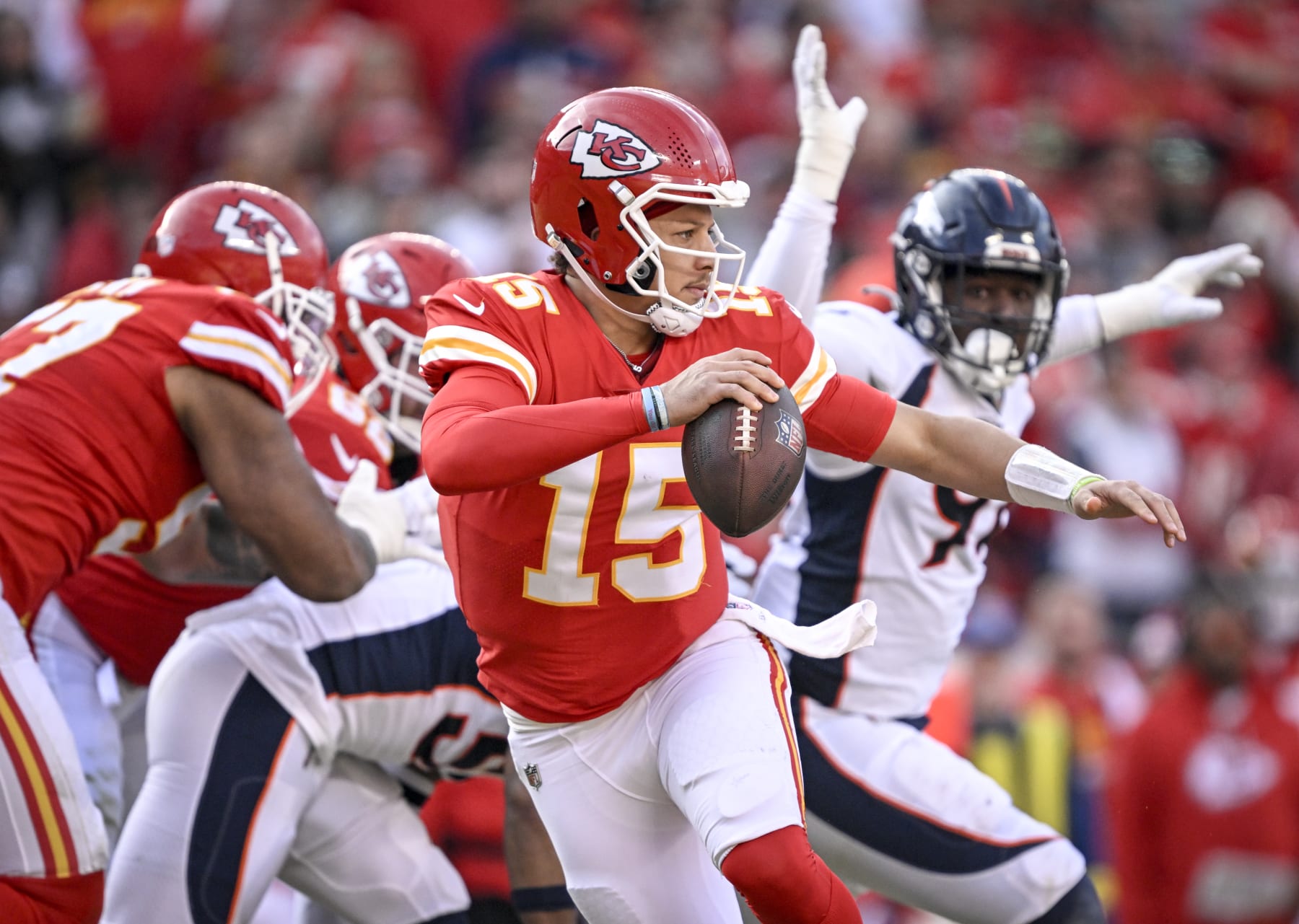 KANSAS CITY, MO - JANUARY 1: Patrick Mahomes (15) of the Kansas City Chiefs breaks the pocket against the Denver Broncos during the third quarter of the Chiefs 27-24 win at GEHA at Arrowhead Stadium on Sunday, January 1, 2023. (Photo by AAron Ontiveroz/MediaNews Group/The Denver Post via Getty Images)