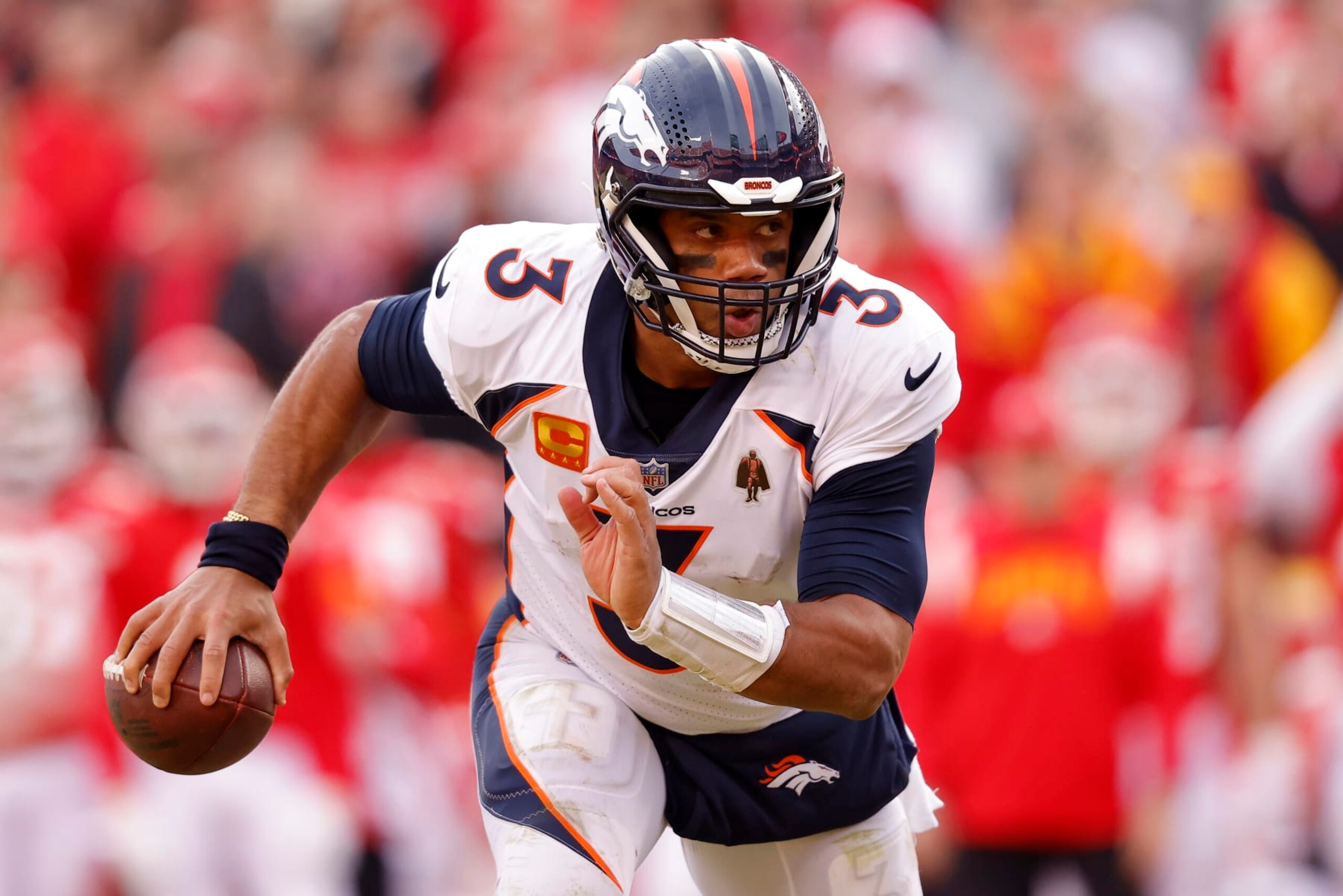 KANSAS CITY, MISSOURI - JANUARY 01: Russell Wilson #3 of the Denver Broncos rushes for a touchdown against the Kansas City Chiefs during the fourth quarter of the game at Arrowhead Stadium on January 01, 2023 in Kansas City, Missouri. (Photo by David Eulitt/Getty Images) KANSAS CITY, MISSOURI - JANUARY 01: Russell Wilson #3 of the Denver Broncos rushes for a touchdown against the Kansas City Chiefs during the fourth quarter of the game at Arrowhead Stadium on January 01, 2023 in Kansas City, Missouri. (Photo by David Eulitt/Getty Images)