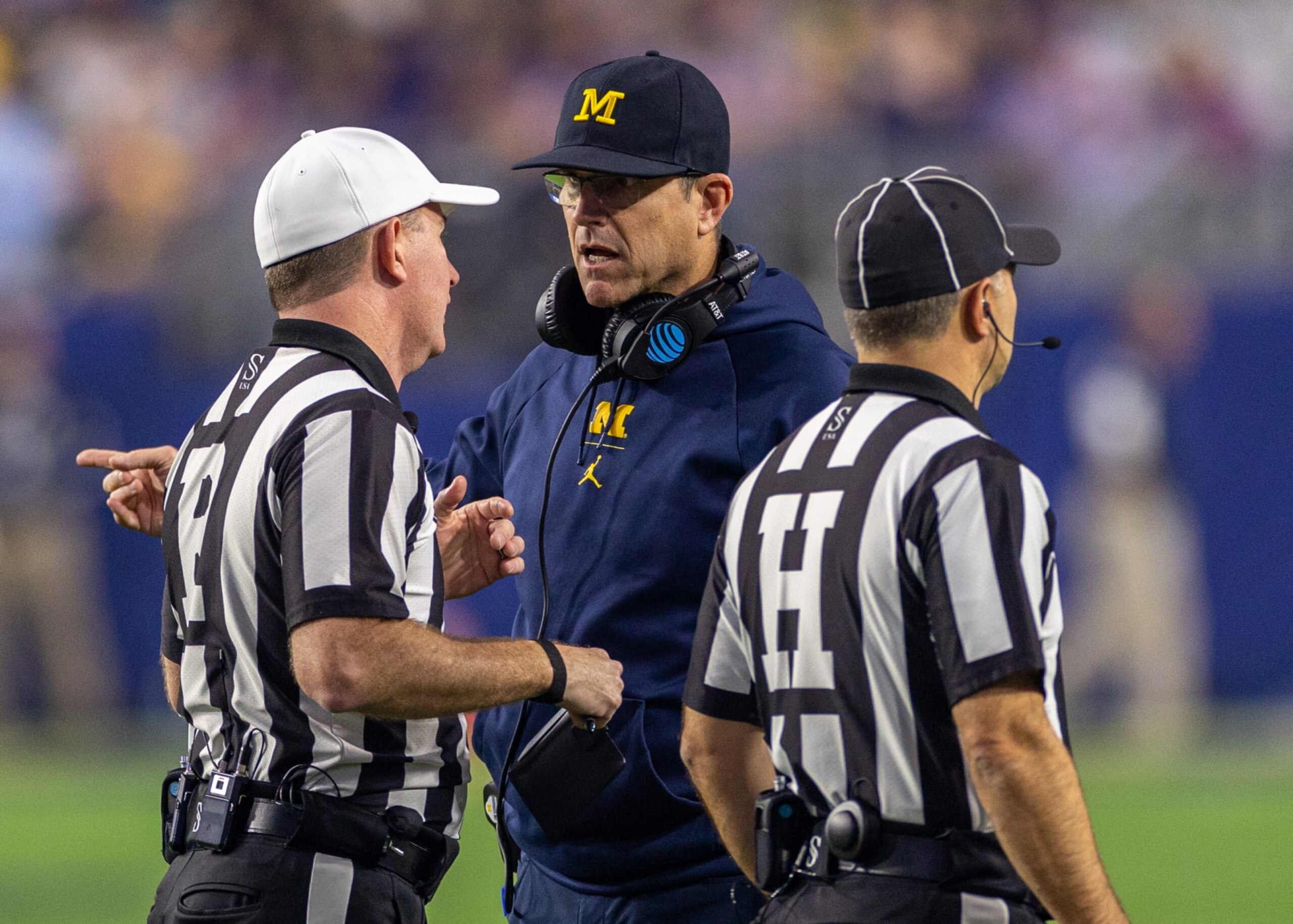 GLENDALE, AZ - DECEMBER 31: Michigan Wolverines head coach Jim Harbaugh talks with referees during the Vrbo Fiesta Bowl between the Michigan Wolverines and the TCU Horned Frogs on Saturday, December 31st, 2022 at State Farm Stadium in Glendale, AZ (Photo by Adam Bow/Icon Sportswire via Getty Images)