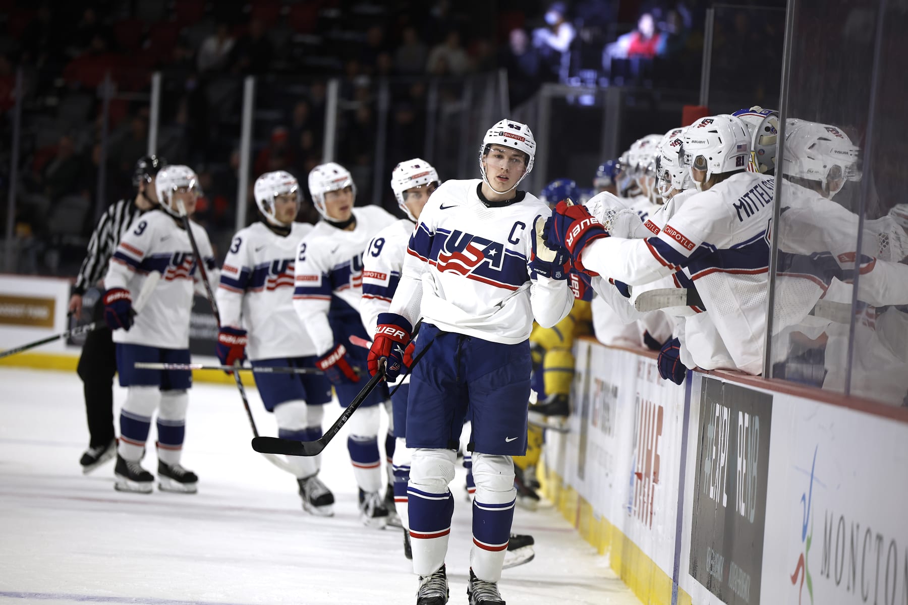 MONCTON, NB - DECEMBER 21: Luke Hughes#43 of Team USA celebrates with team on first goal  against Sweden in the first period during the 2023 IIHF World Junior Championship game at Avenir Centre on December 21, 2022 in Moncton, Canada. (Photo by Dale Preston/Getty Images)