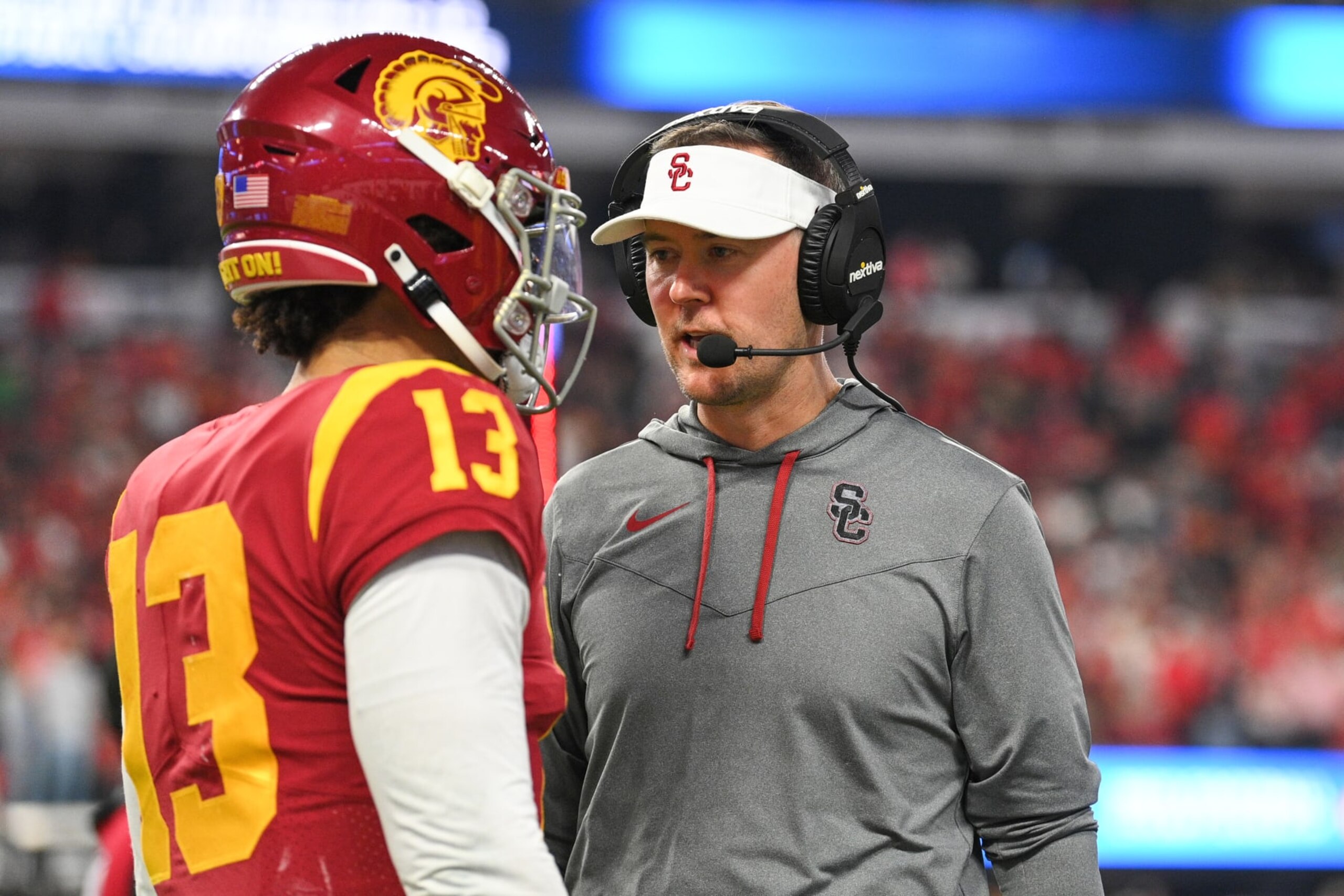 LAS VEGAS, NV - DECEMBER 02: USC Trojans quarterback Caleb Williams (13) talks with head coach Lincoln Riley during the Pac-12 Conference championship game between the Utah Utes and the USC Trojans at Allegiant Stadium on December 2, 2022 in Las Vegas, Nevada. (Photo by Brian Rothmuller/Icon Sportswire via Getty Images) LAS VEGAS, NV - DECEMBER 02: USC Trojans quarterback Caleb Williams (13) talks with head coach Lincoln Riley during the Pac-12 Conference championship game between the Utah Utes and the USC Trojans at Allegiant Stadium on December 2, 2022 in Las Vegas, Nevada. (Photo by Brian Rothmuller/Icon Sportswire via Getty Images)